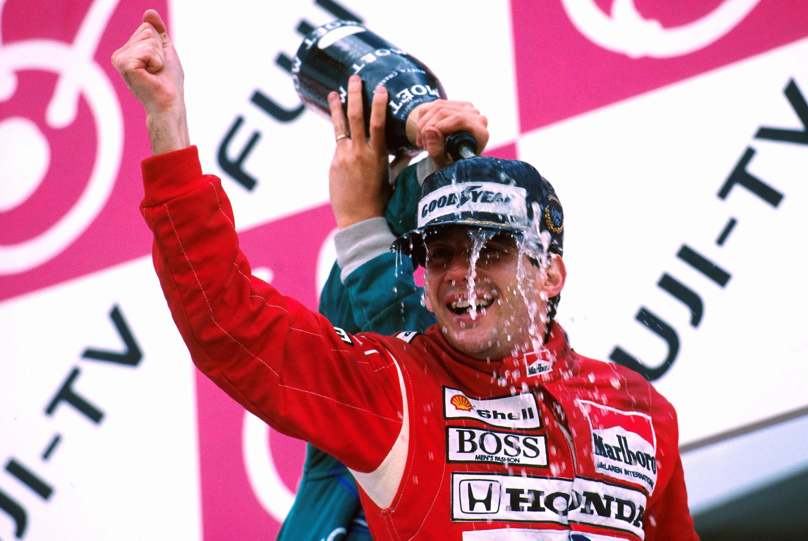 Winner Ayrton Senna (BRA) celebrates his win and world championship on the podium Japanese GP,