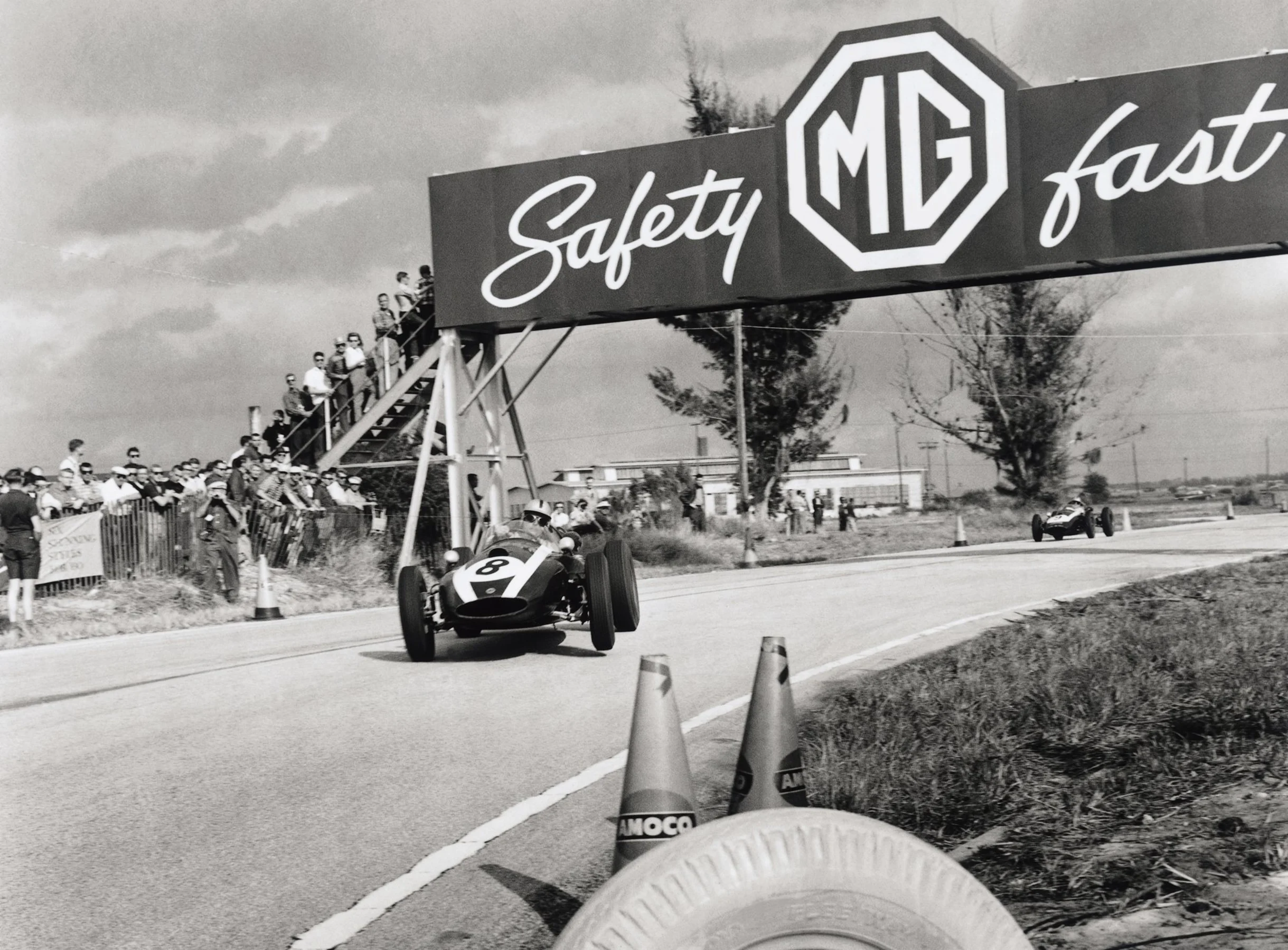 Jack Brabham, Cooper T51-Climax, 4th position, leads Bruce McLaren, Cooper T45-Climax, 1st