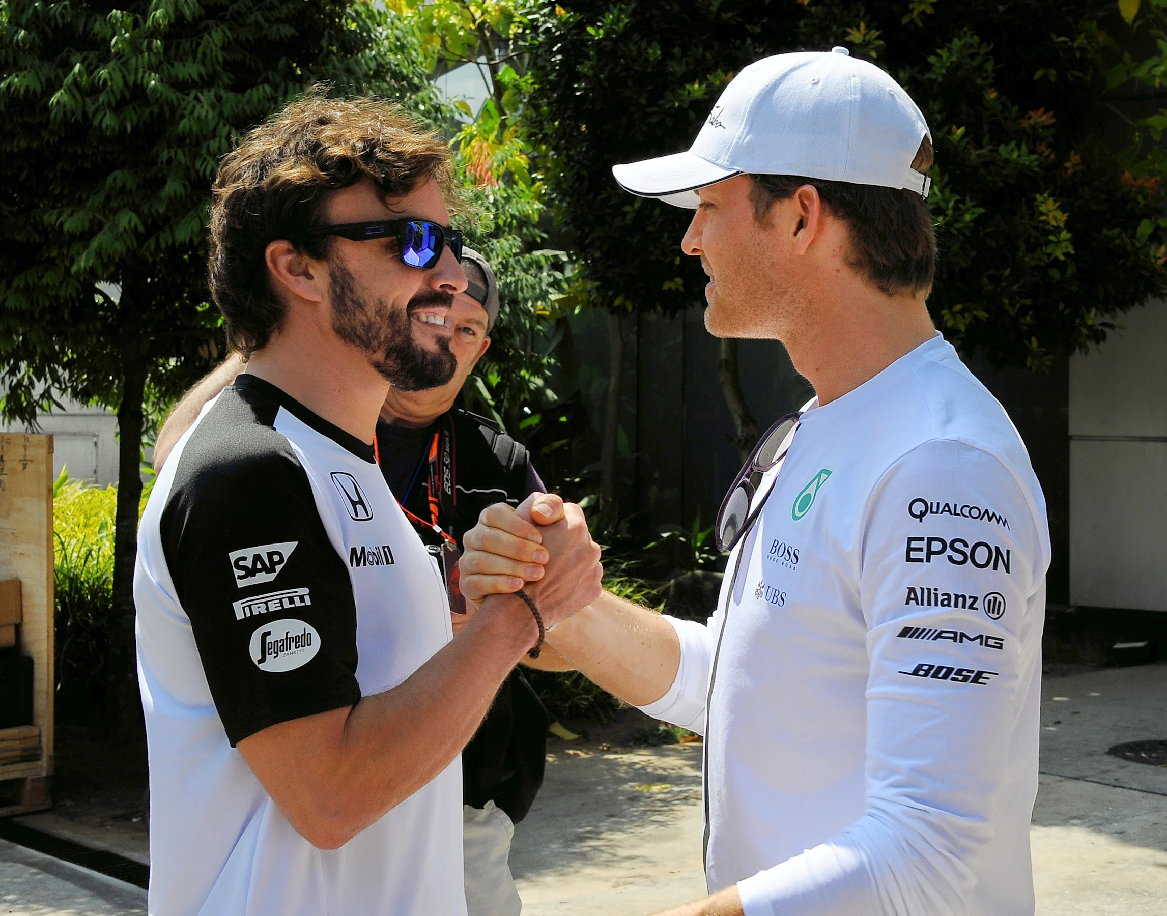 Fernando Alonso (ESP) and Nico Rosberg (GER). Formula One World Championship, Rd2, Malaysian Grand