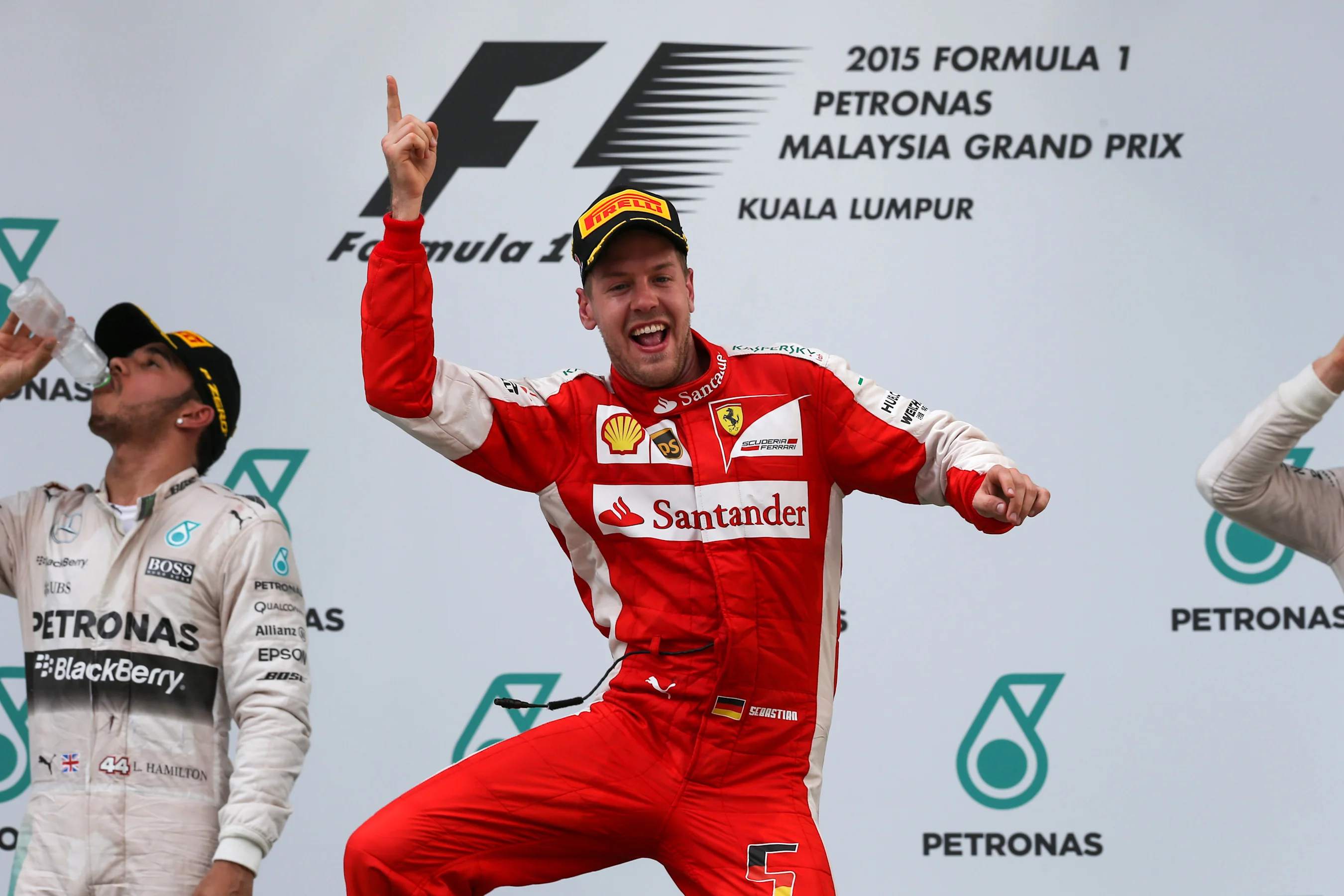 Race winner Sebastian Vettel (GER) Ferrari celebrates on the podium at Formula One World