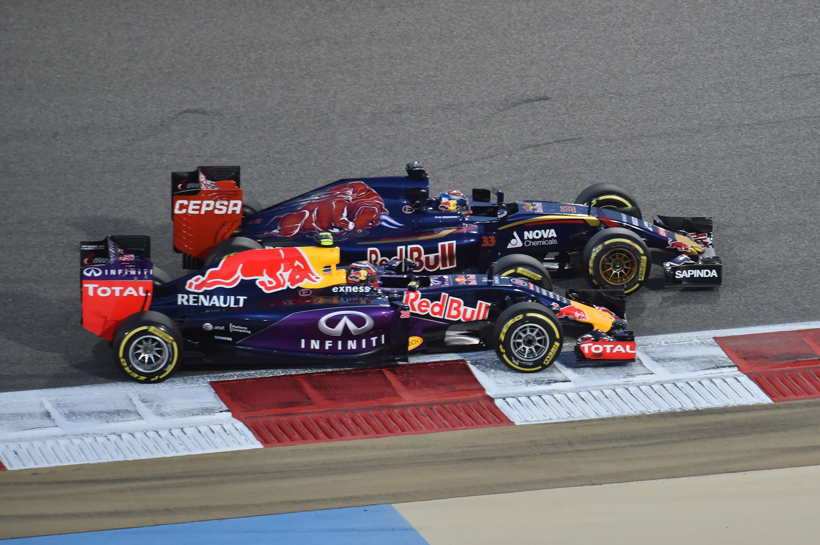 Max Verstappen (NDL) Scuderia Toro Rosso STR10 and Daniil Kvyat (RUS) Red Bull Racing RB11 at