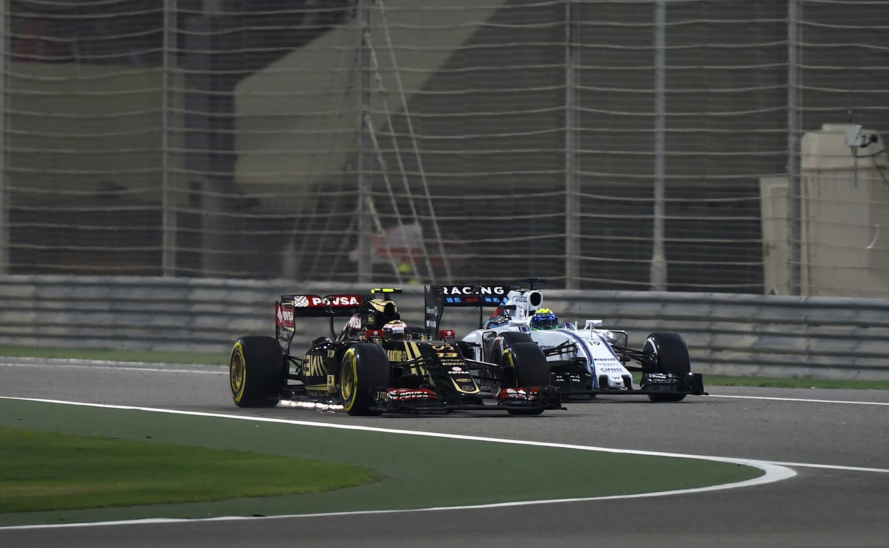 Pastor Maldonado (VEN) Lotus E23 Hybrid and Felipe Massa (BRA) Williams FW37 battle at Formula One