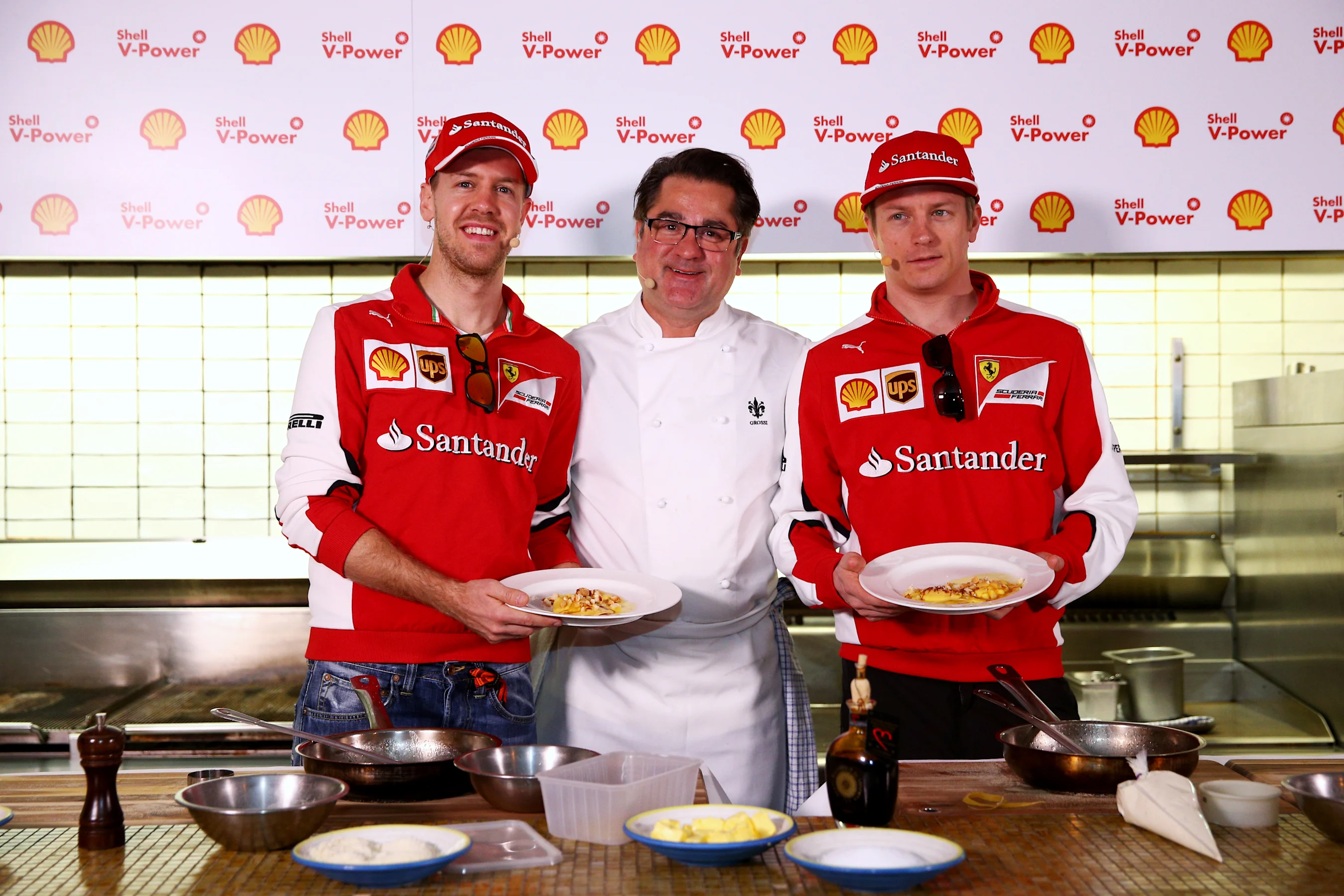 MELBOURNE, AUSTRALIA - MARCH 12: Sebastian Vettel of Germany and Ferrari and Kimi Raikkonen of
