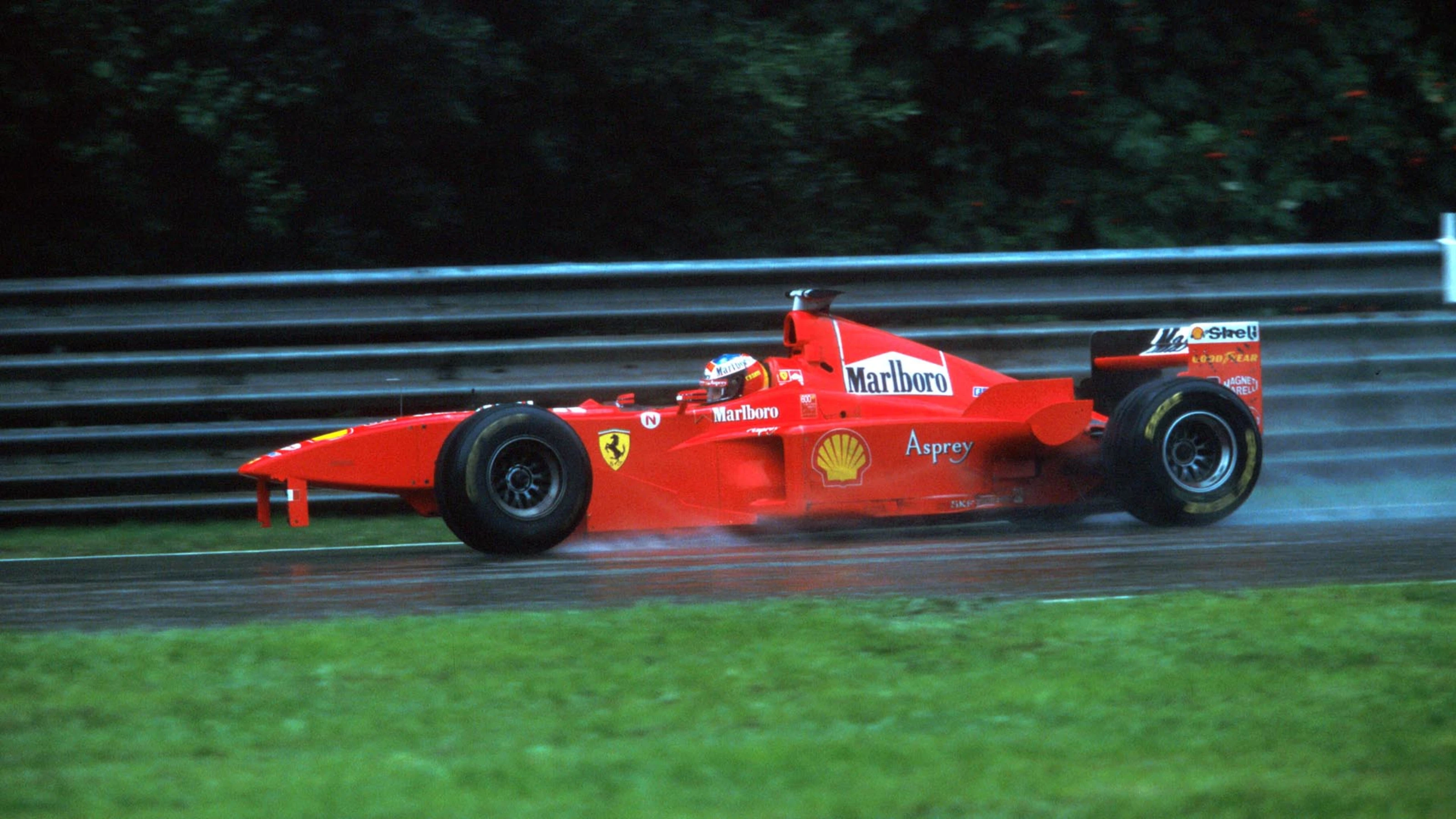 Michael Schumacher (GER), Ferrari F300 returns to the pits after running into the back of David