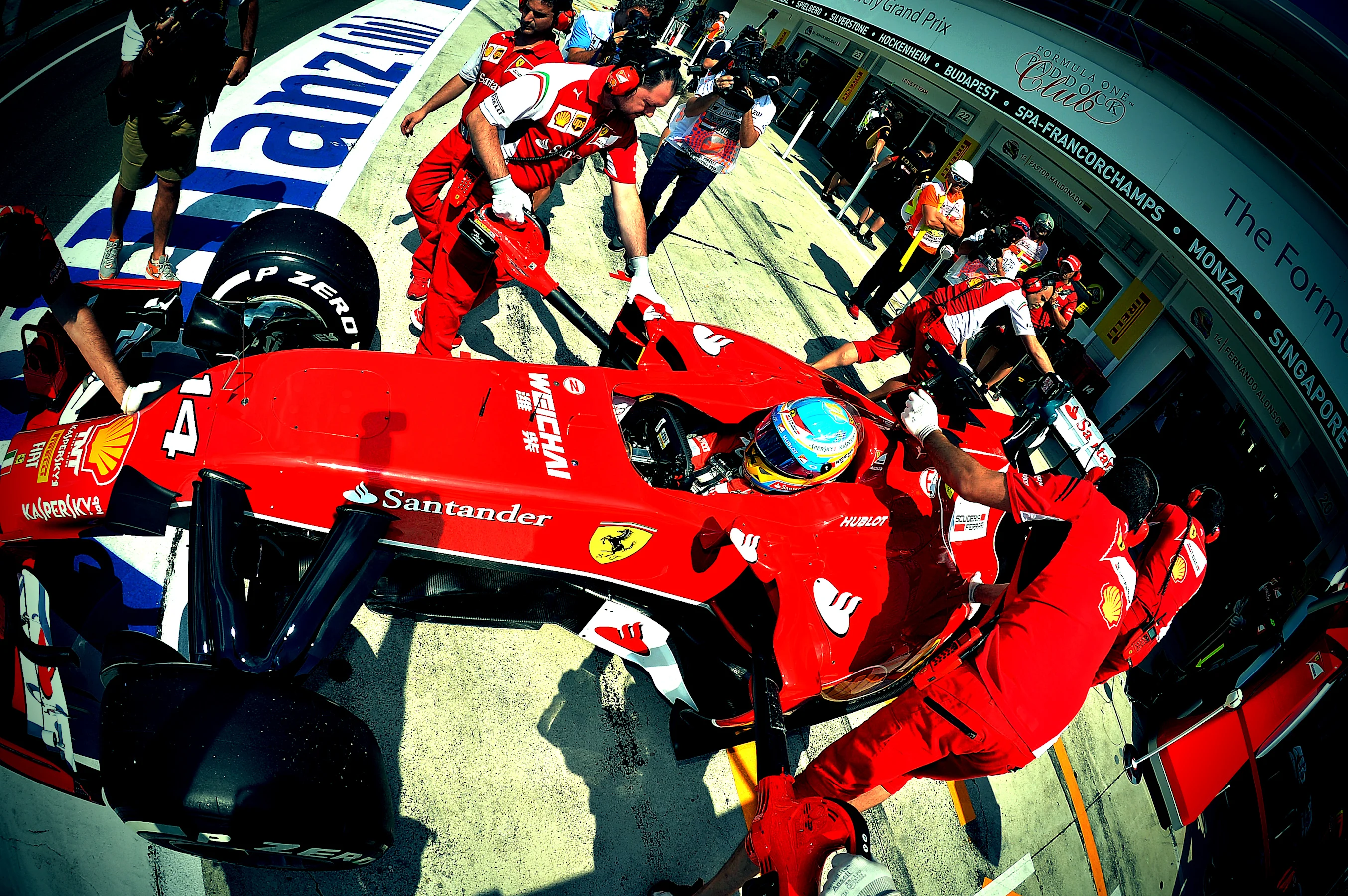Fernando Alonso (ESP) Ferrari F14 T is pushed back into the garage. Formula One World