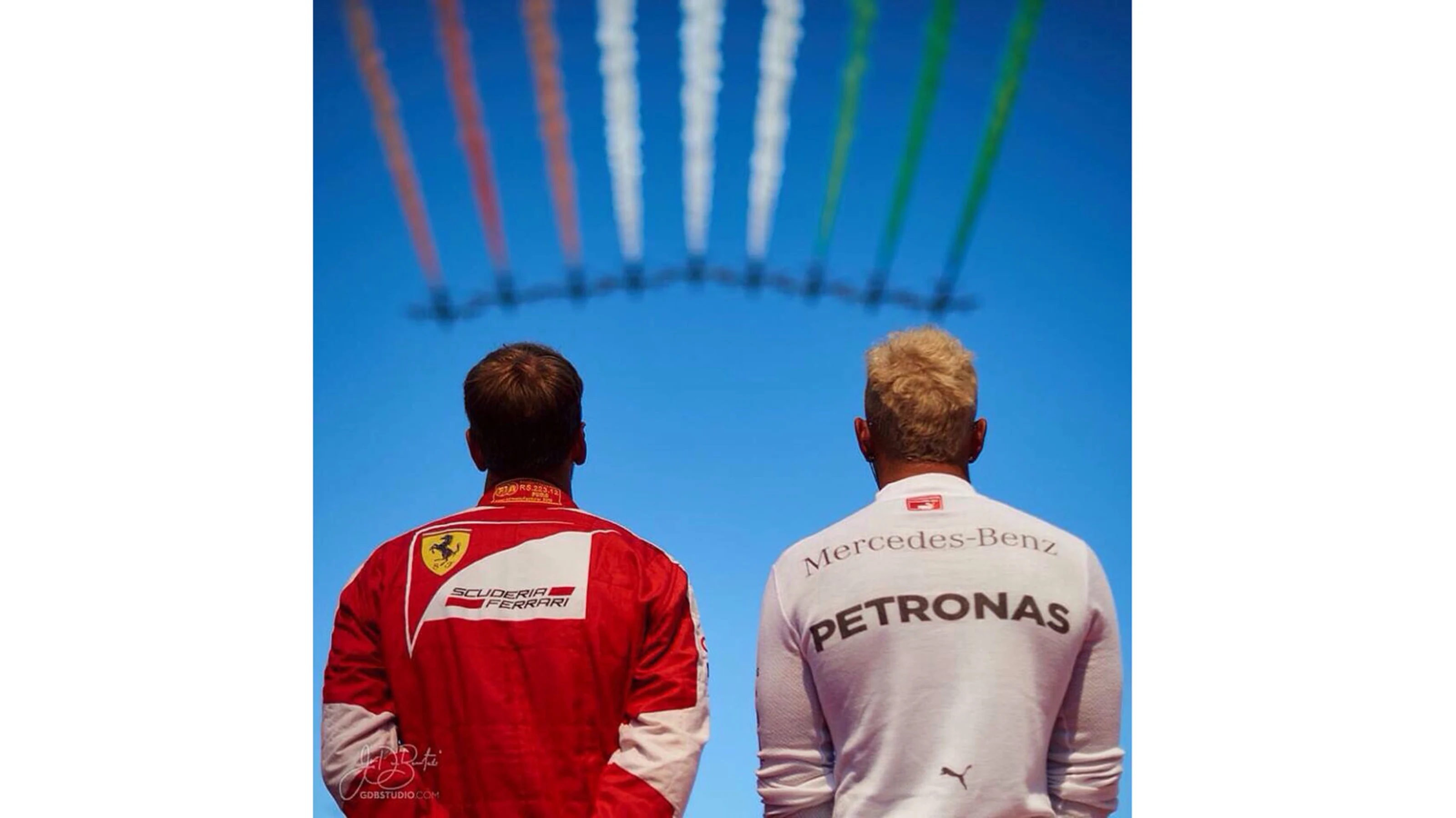 Ferrari's Sebastian Vettel and Mercedes' Lewis Hamilton watch the aero display at Formula One World