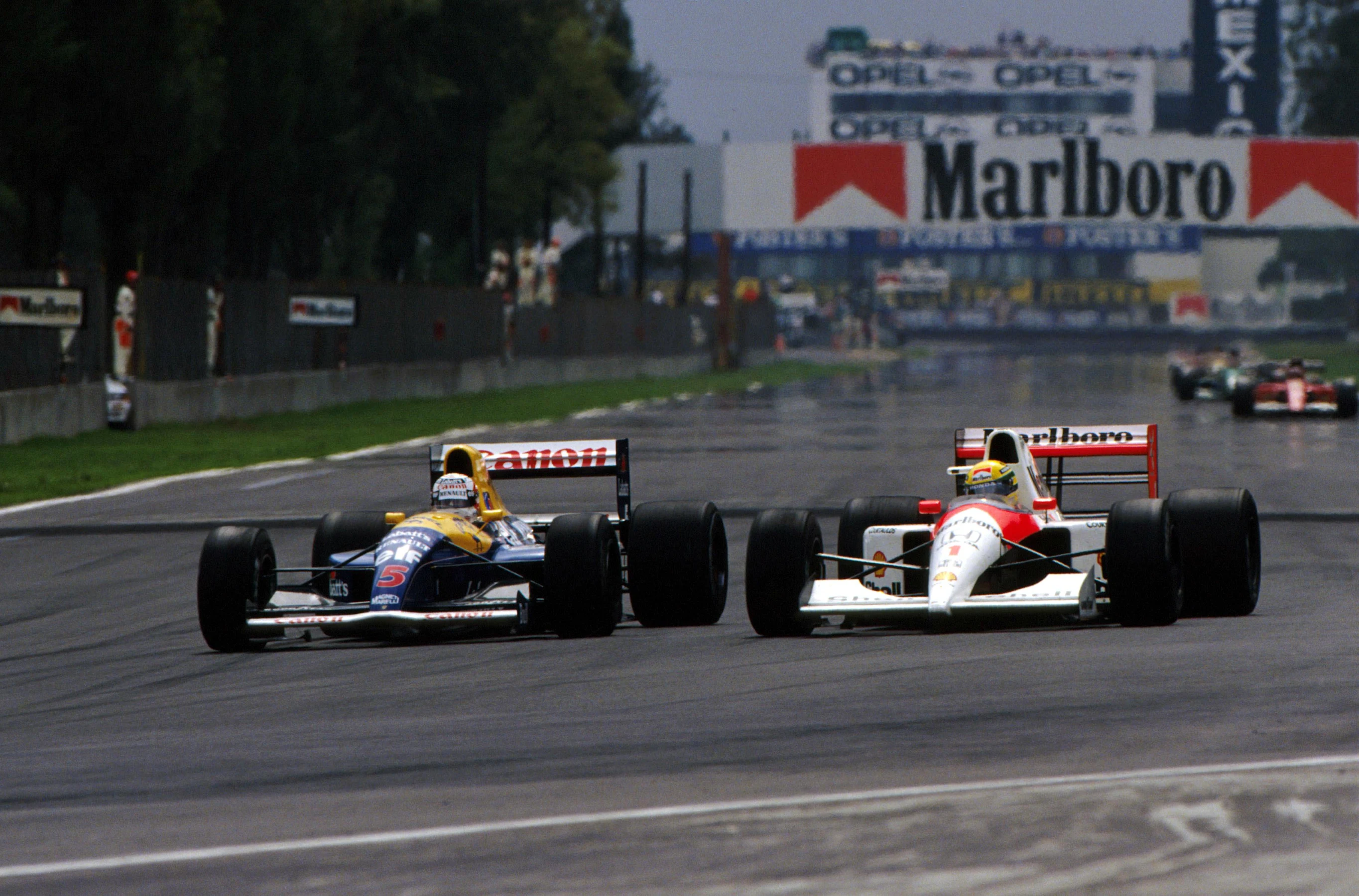 Second place finisher Nigel Mansell (GBR) Williams FW14 (left) and third place finisher Ayrton