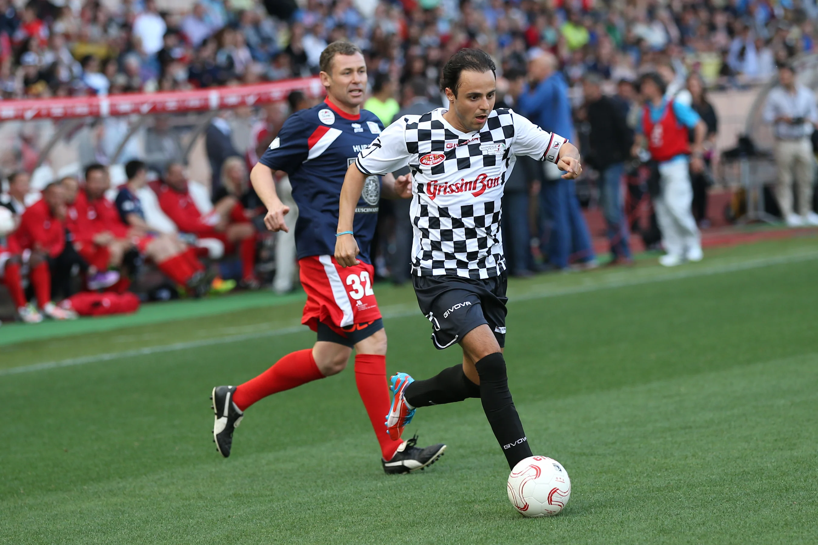 Tom Kristensen (DEN) and Felipe Massa (BRA) Williams at World Stars Football Match, Stade Luis II,