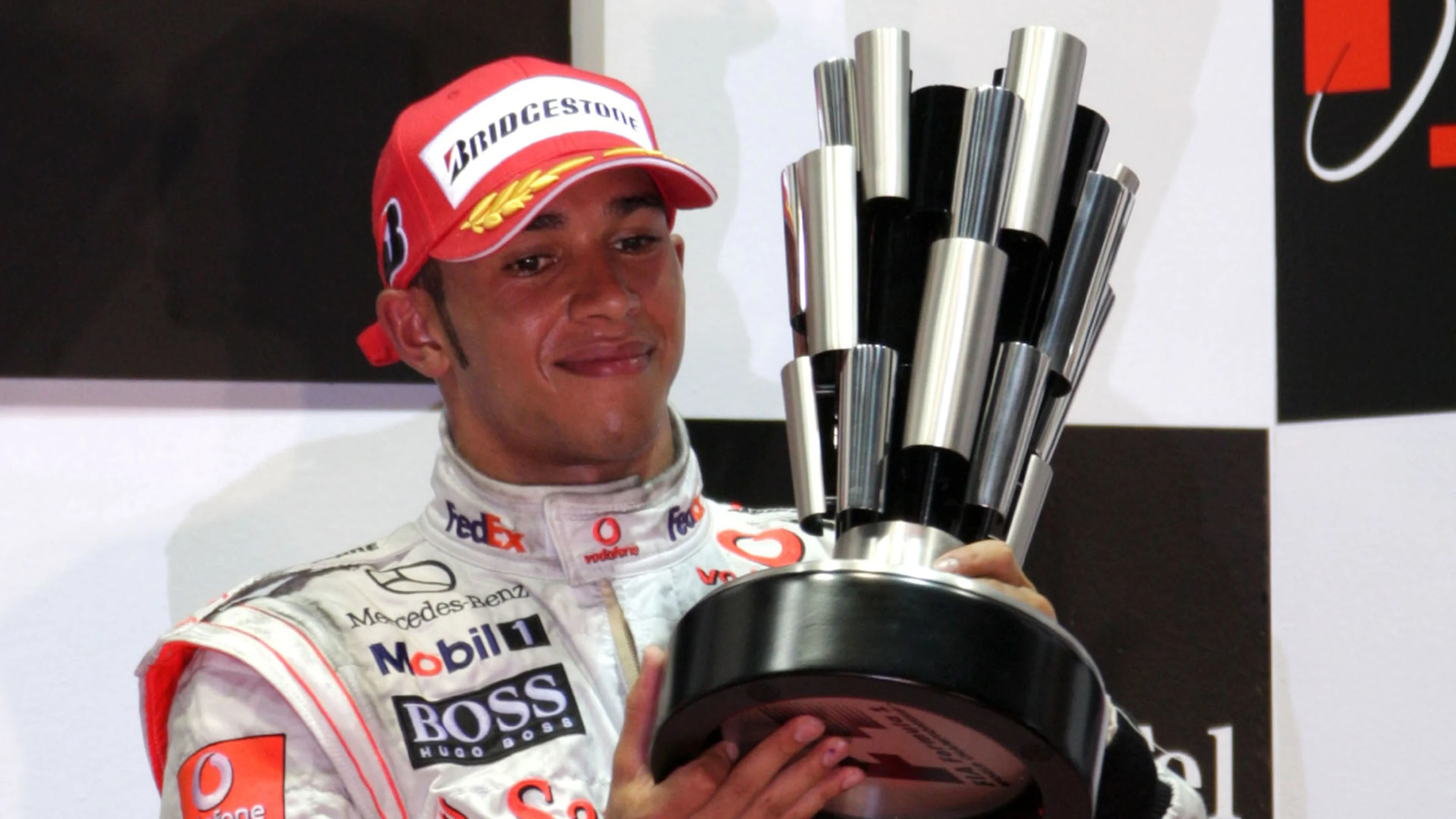 Lewis Hamilton (GBR) McLaren celebrates on the podium Formula One World Championship, Rd 15,