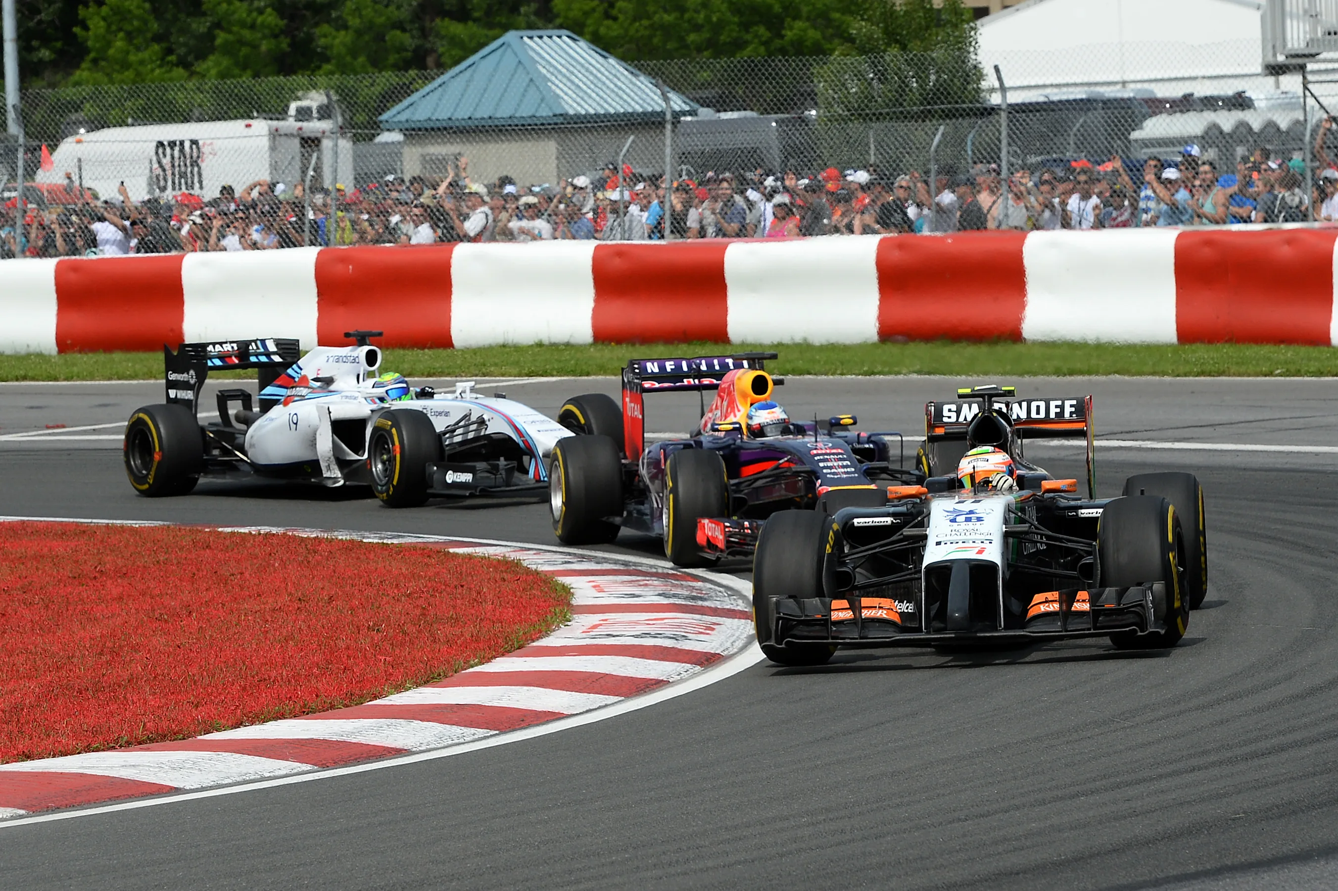 Sergio Perez (MEX) Force India VJM07 leads Sebastian Vettel (GER) Red Bull Racing RB10 and Felipe