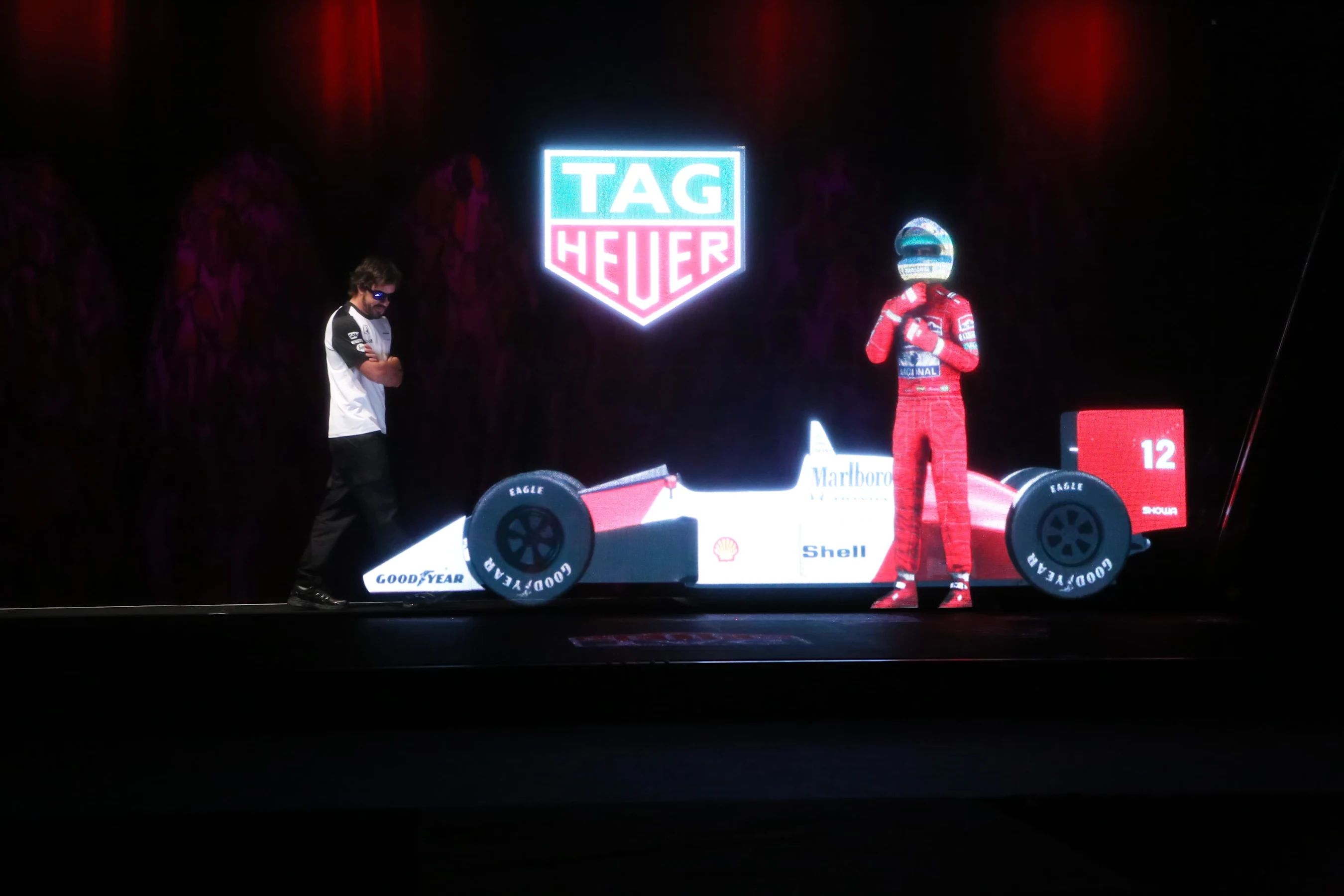 McLaren’s Fernando Alonso comes face to face with a hologram of the late Ayrton Senna at team