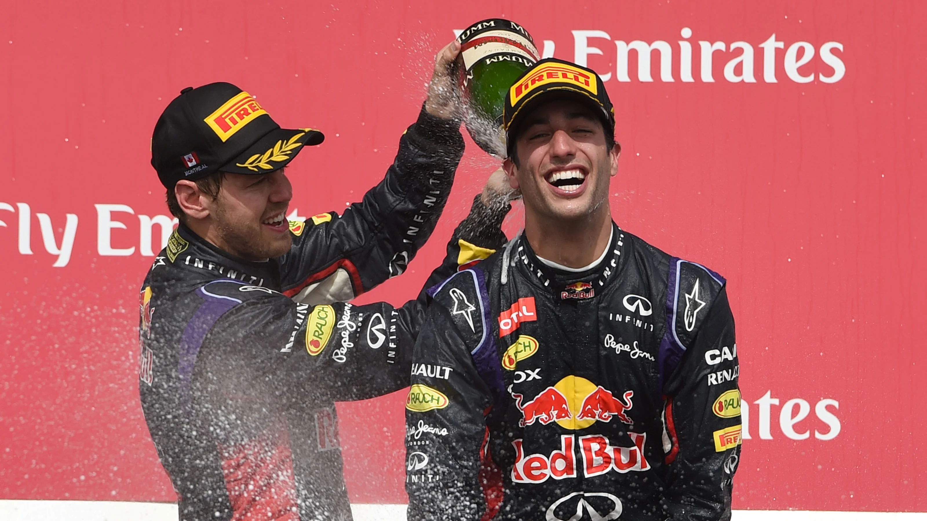 (L to R): Sebastian Vettel (GER) Red Bull Racing RB10 and race winner Daniel Ricciardo (AUS) Red