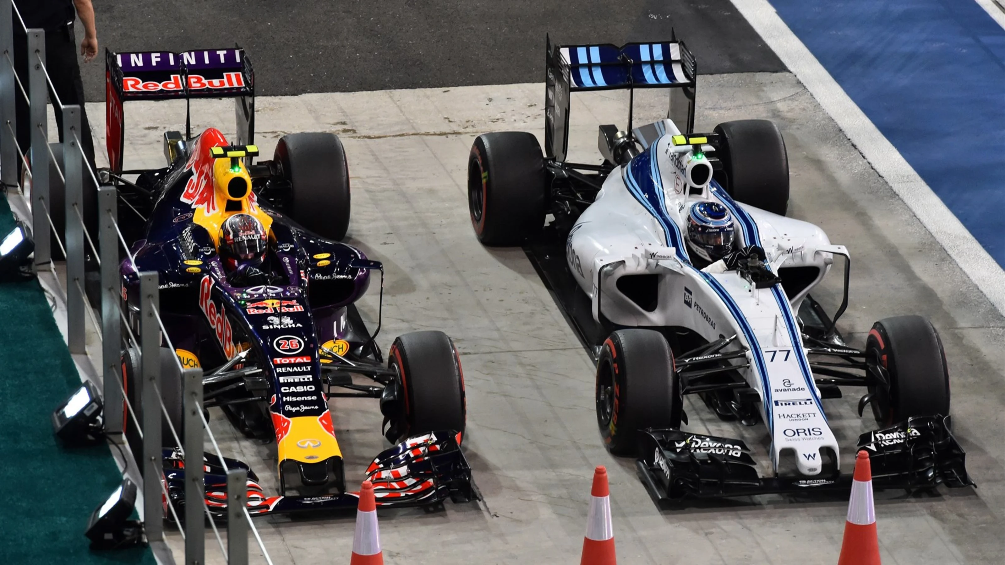 Daniil Kvyat (RUS) Red Bull Racing RB11 and Valtteri Bottas (FIN) Williams FW37 in parc ferme at