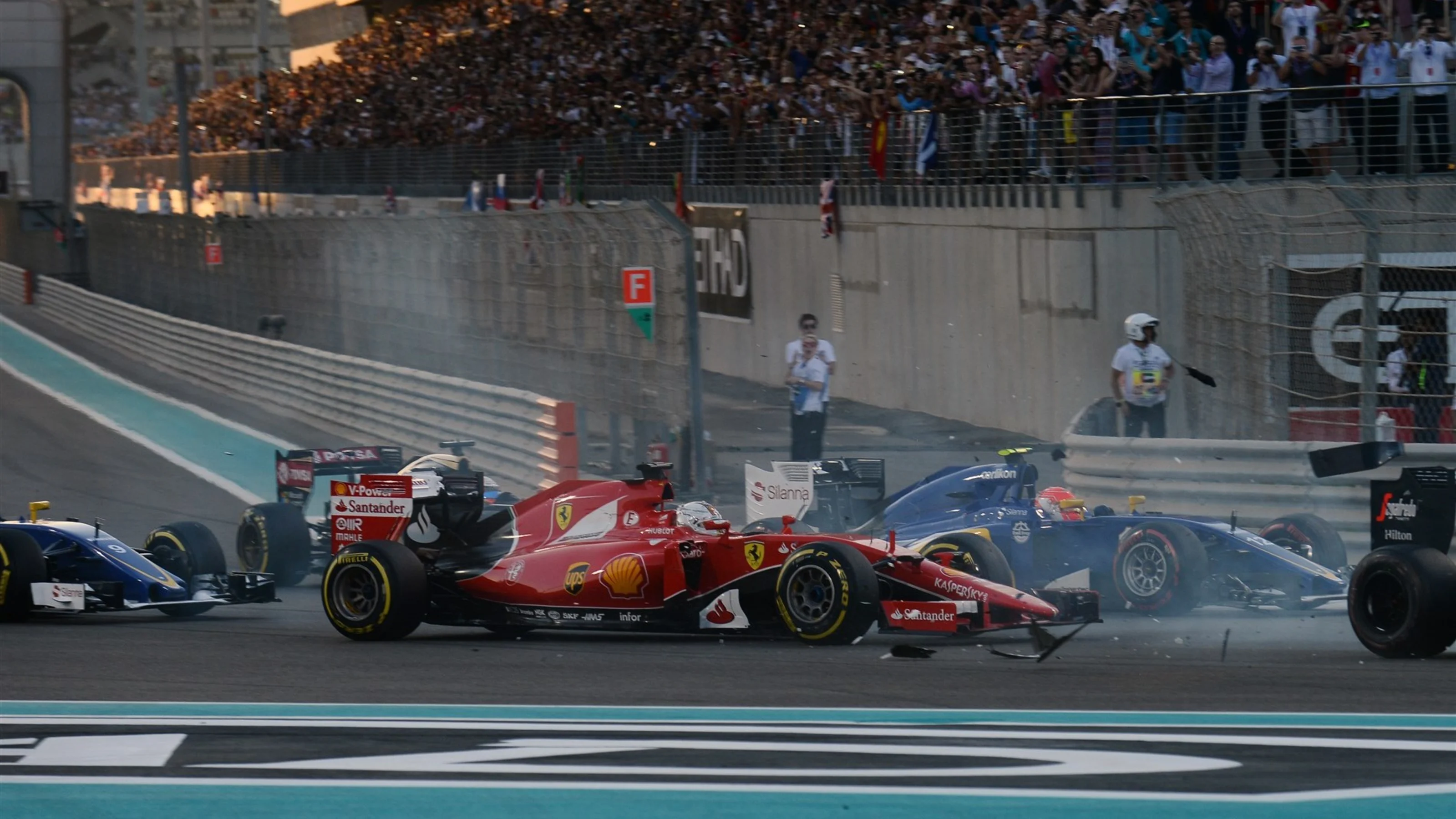 Pastor Maldonado (VEN) Lotus E23 Hybrid and Fernando Alonso (ESP) McLaren MP4-30 collide at the