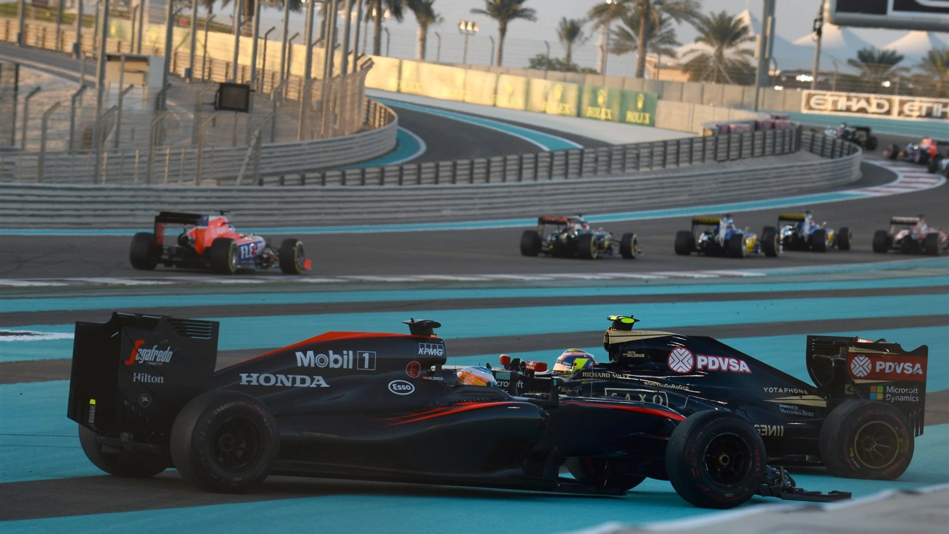 Pastor Maldonado (VEN) Lotus E23 Hybrid and Fernando Alonso (ESP) McLaren MP4-30 collide at the