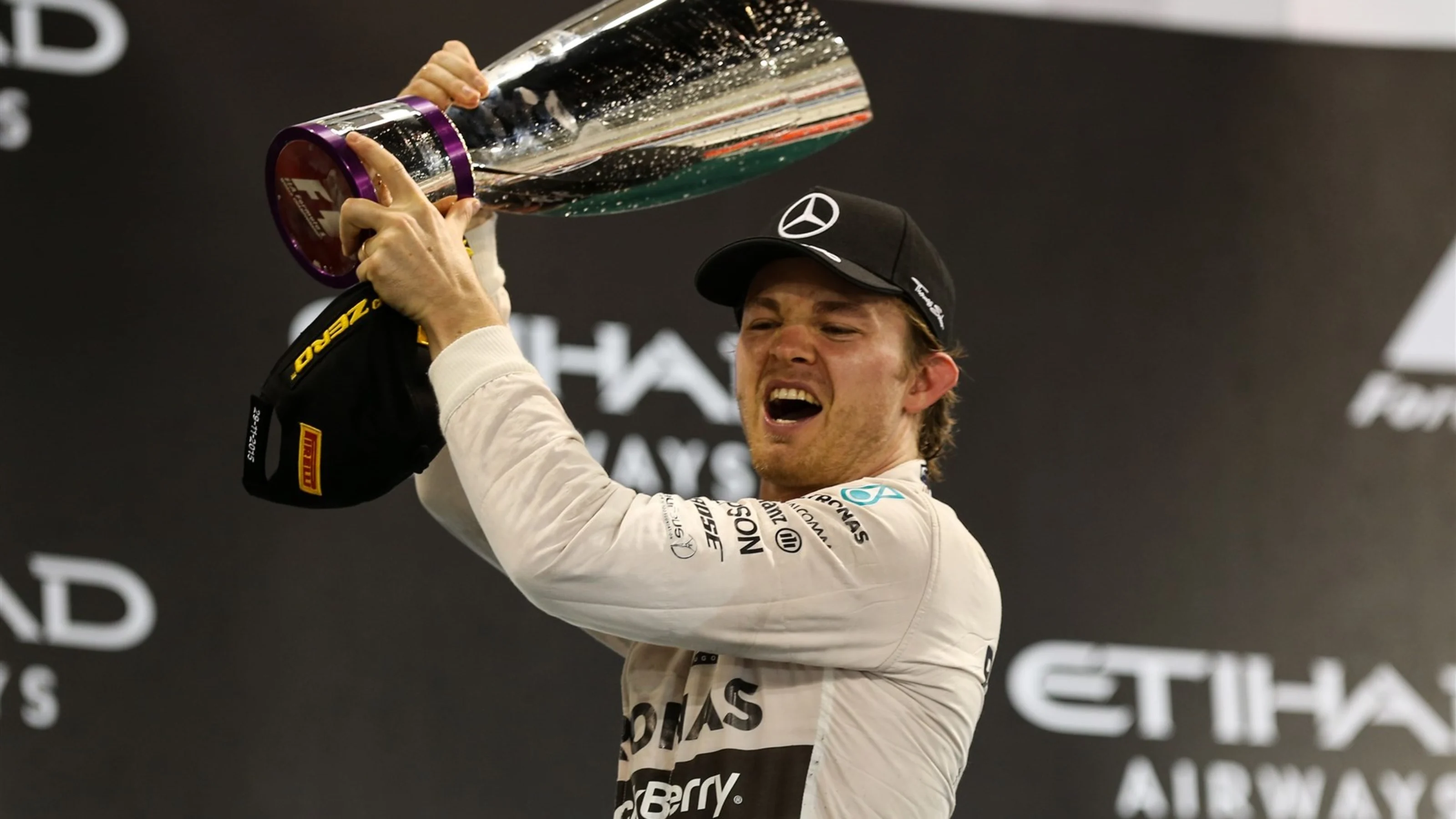 Race winner Nico Rosberg (GER) Mercedes AMG F1 celebrates with the trophy on the podium at Formula