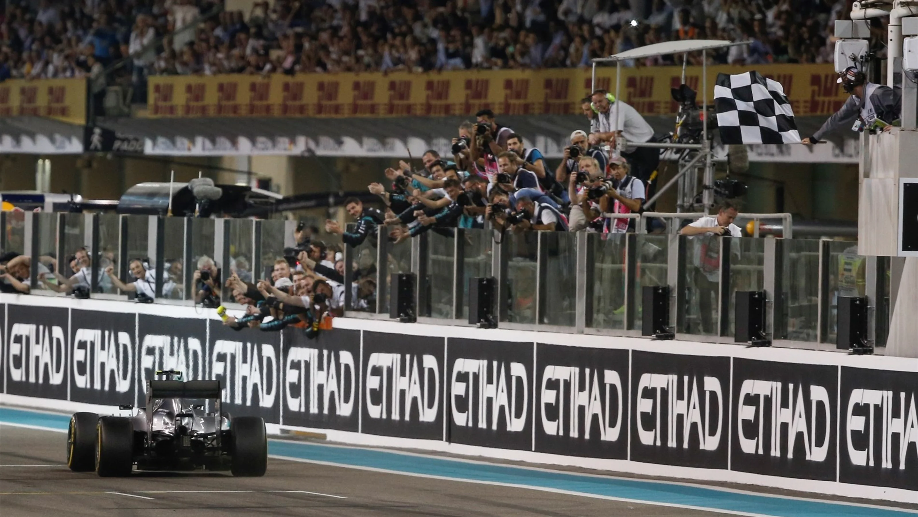 Race winner Nico Rosberg (GER) Mercedes AMG F1 W06 takes the chequered flag at Formula One World