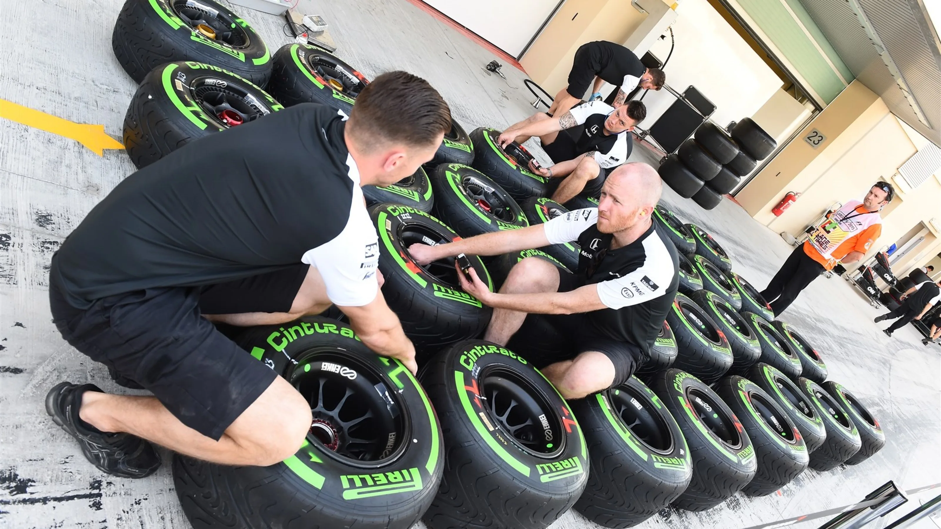 McLaren mechanics and Pirelli tyres at Formula One World Championship, Rd19, Abu Dhabi Grand Prix,