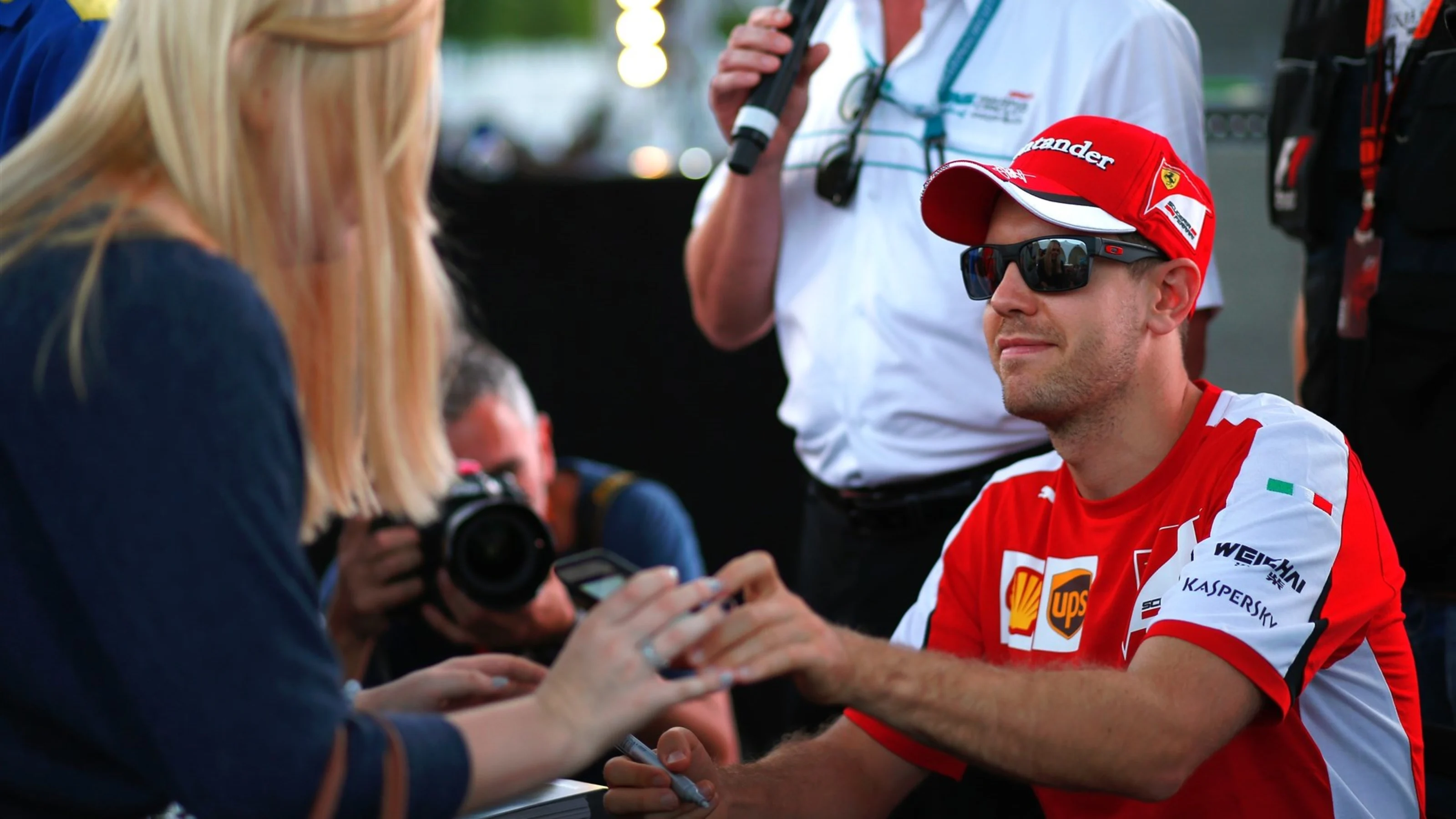 Sebastian Vettel (GER) Ferrari signs autographs for the fans at Formula One World Championship,