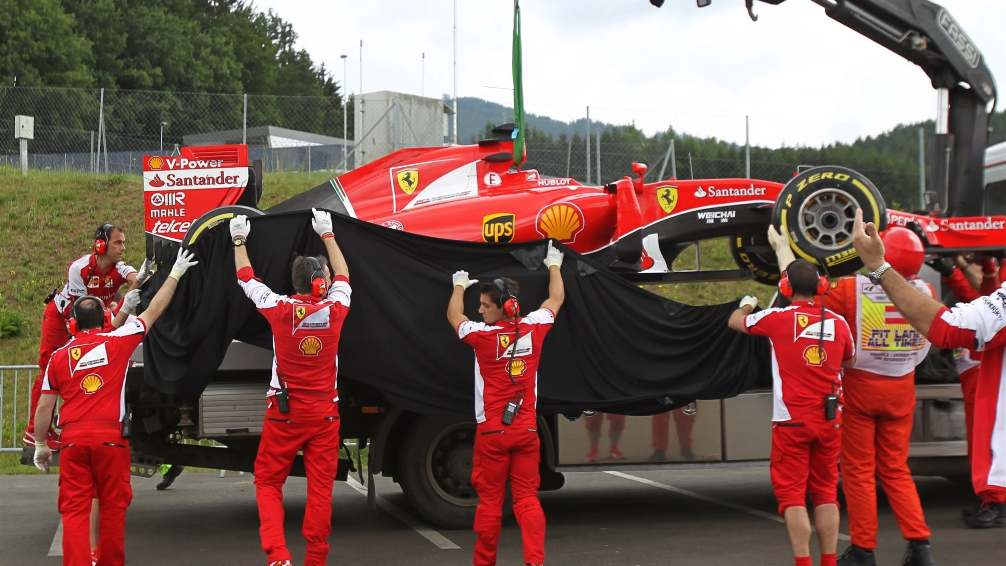 The car of Sebastian Vettel (GER) Ferrari SF15-T is recovered after stopping on track in FP1 at