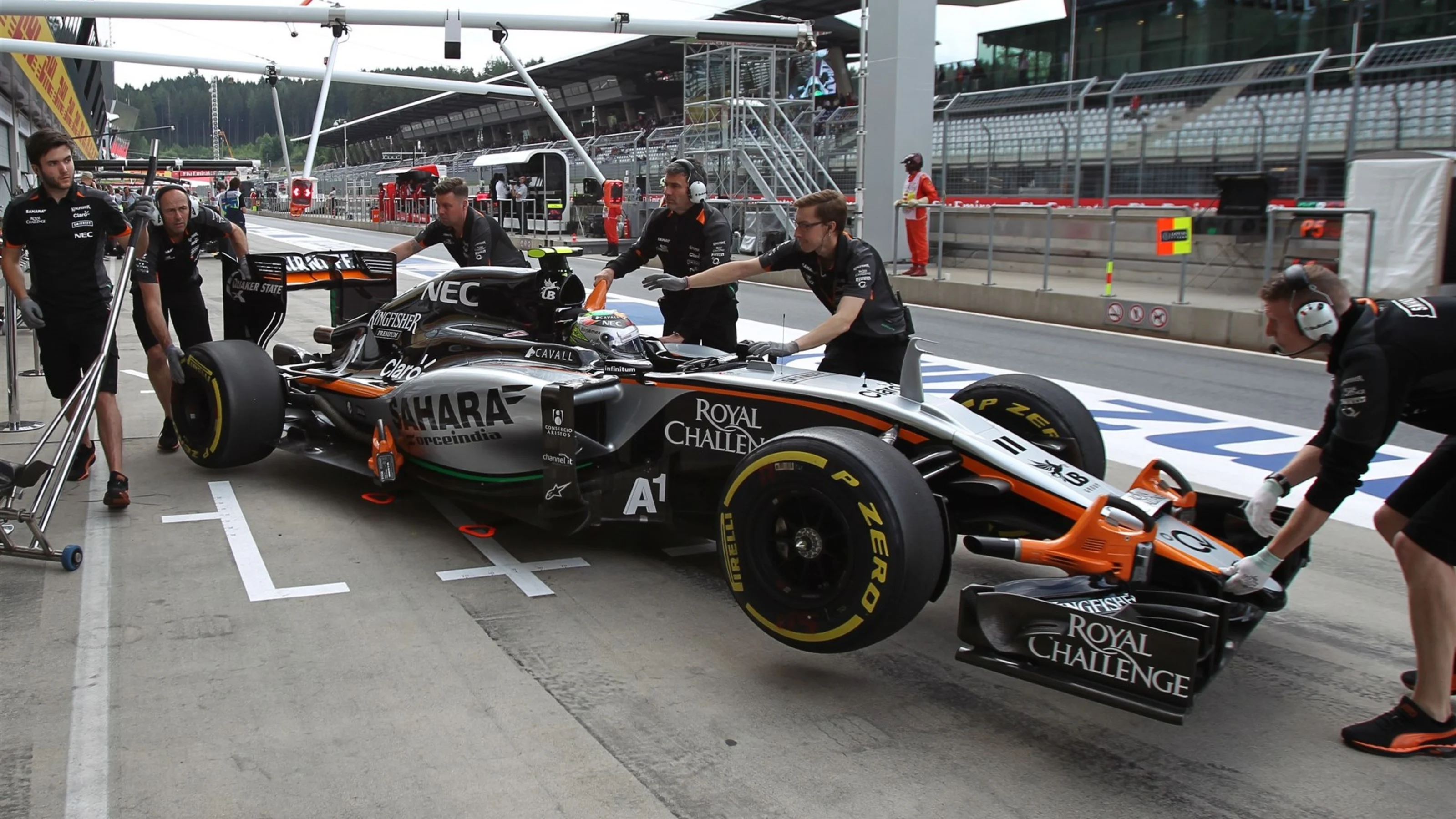 Sergio Perez (MEX) Force India VJM08 is pushed back into the garage at Formula One World