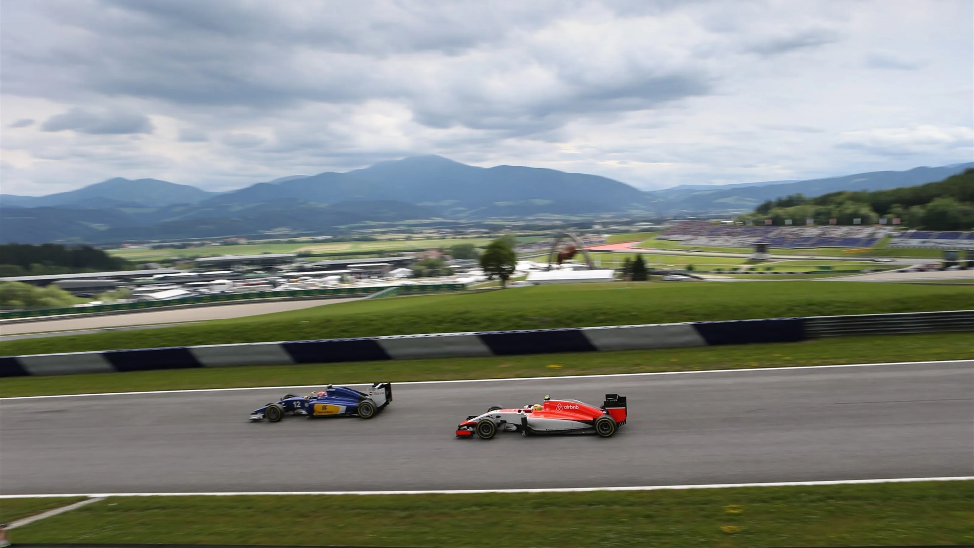 Felipe Nasr (BRA) Sauber C34 and Roberto Merhi (ESP) Manor GP at Formula One World Championship,