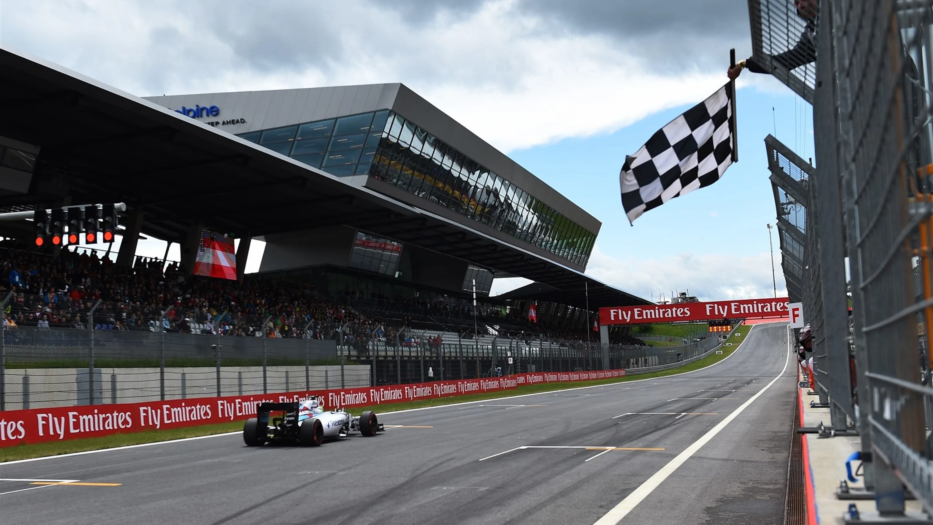 Felipe Massa (BRA) Williams FW37 takes the chequered flag at  the end of Qualifying at Formula One