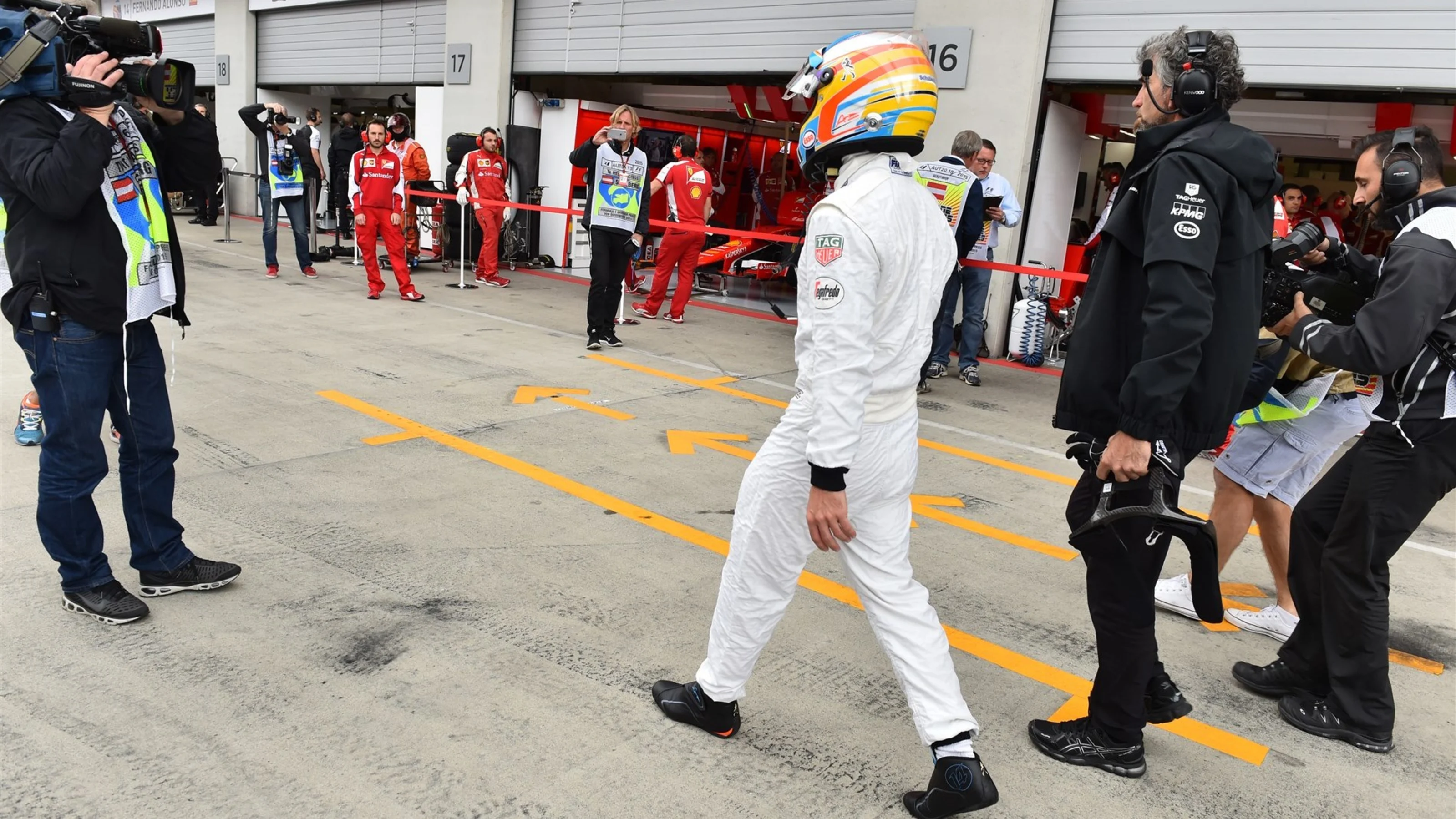 Fernando Alonso (ESP) McLaren walks in after stopping on track in FP3 at Formula One World