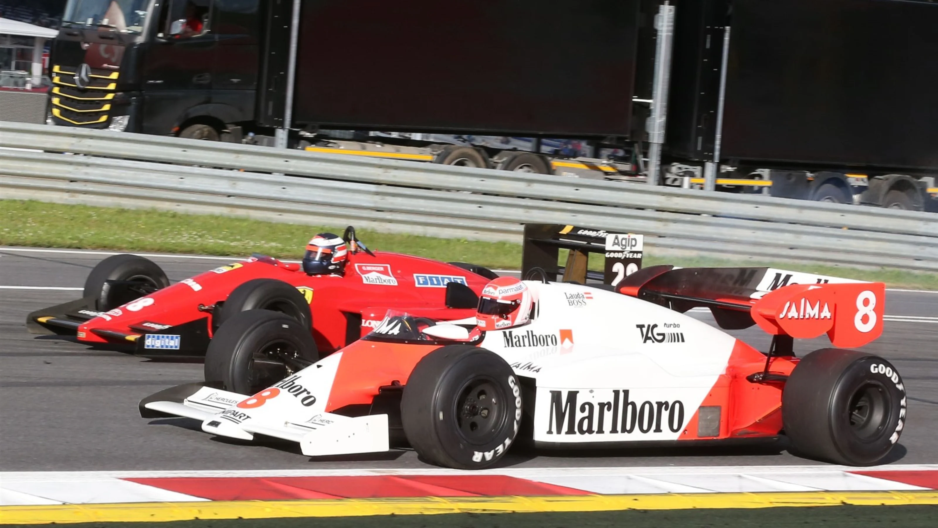 Niki Lauda (AUT) McLaren MP4-2 and Gerhard Berger (AUT) Ferrari F1/87-88C at the Legends Parade at