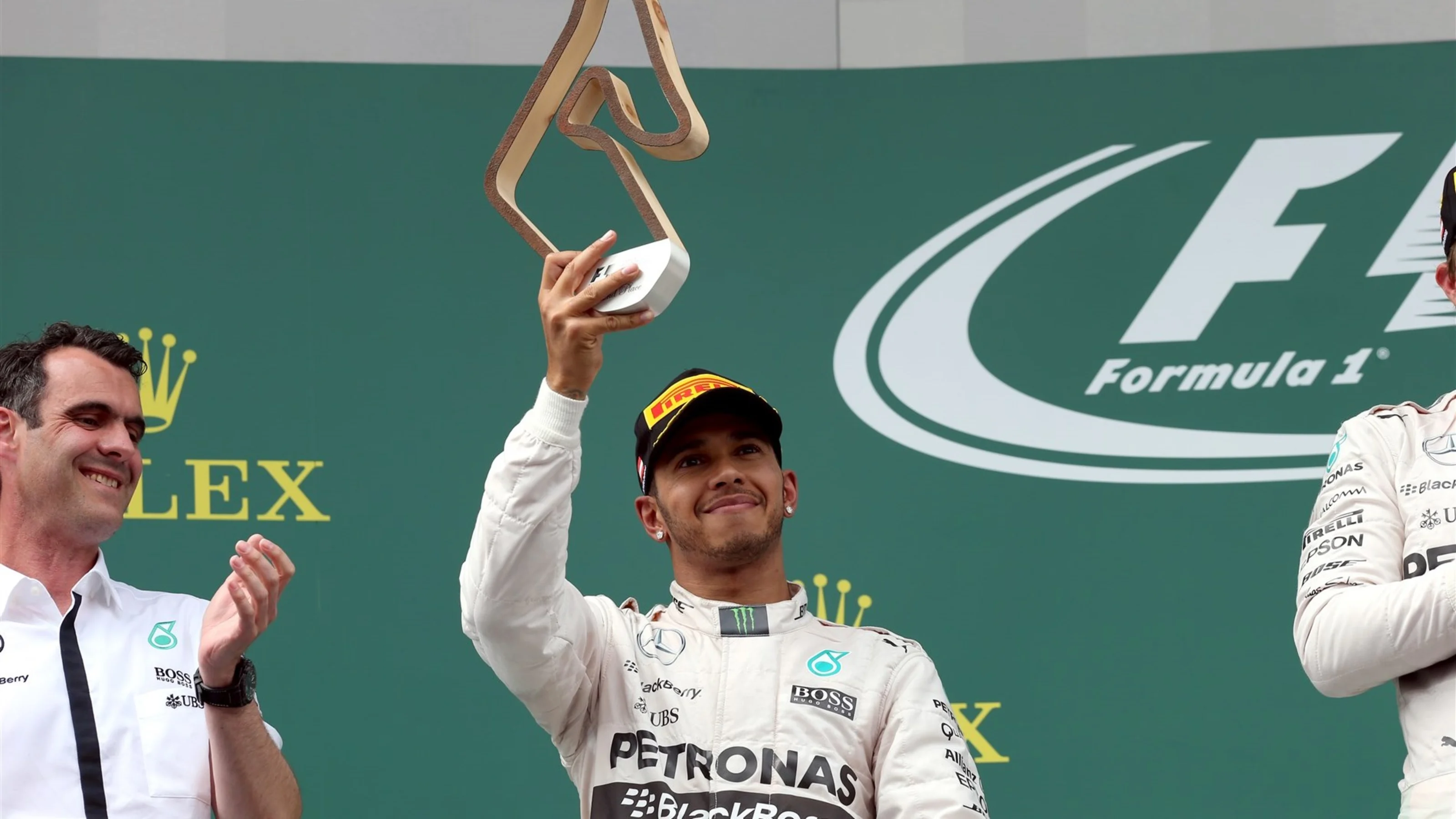 Lewis Hamilton (GBR) Mercedes AMG F1 celebrates with the tyrophy on the podium at Formula One World