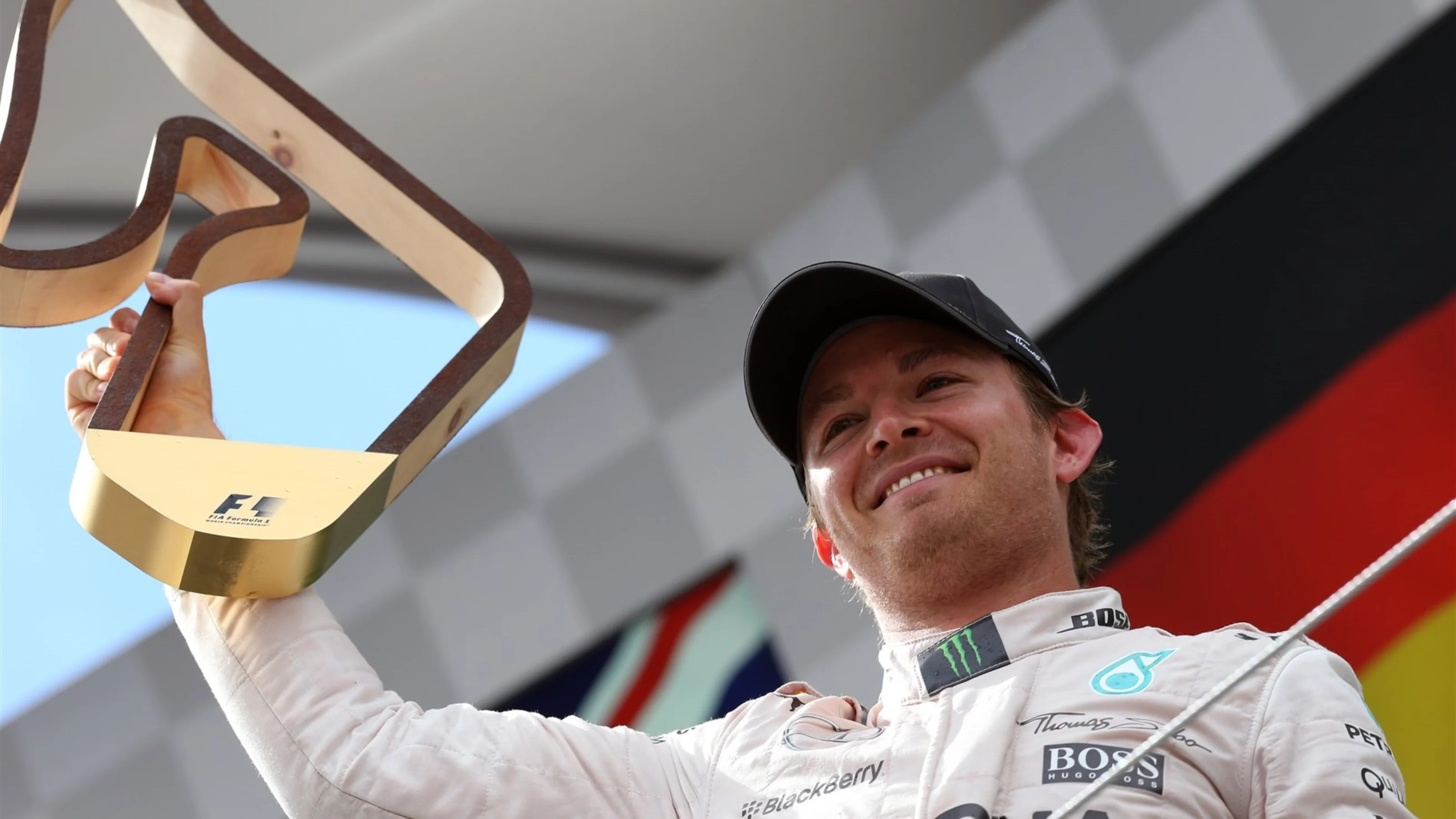 Race winner Nico Rosberg (GER) Mercedes AMG F1 celebrates with the trophy on the podium at Formula