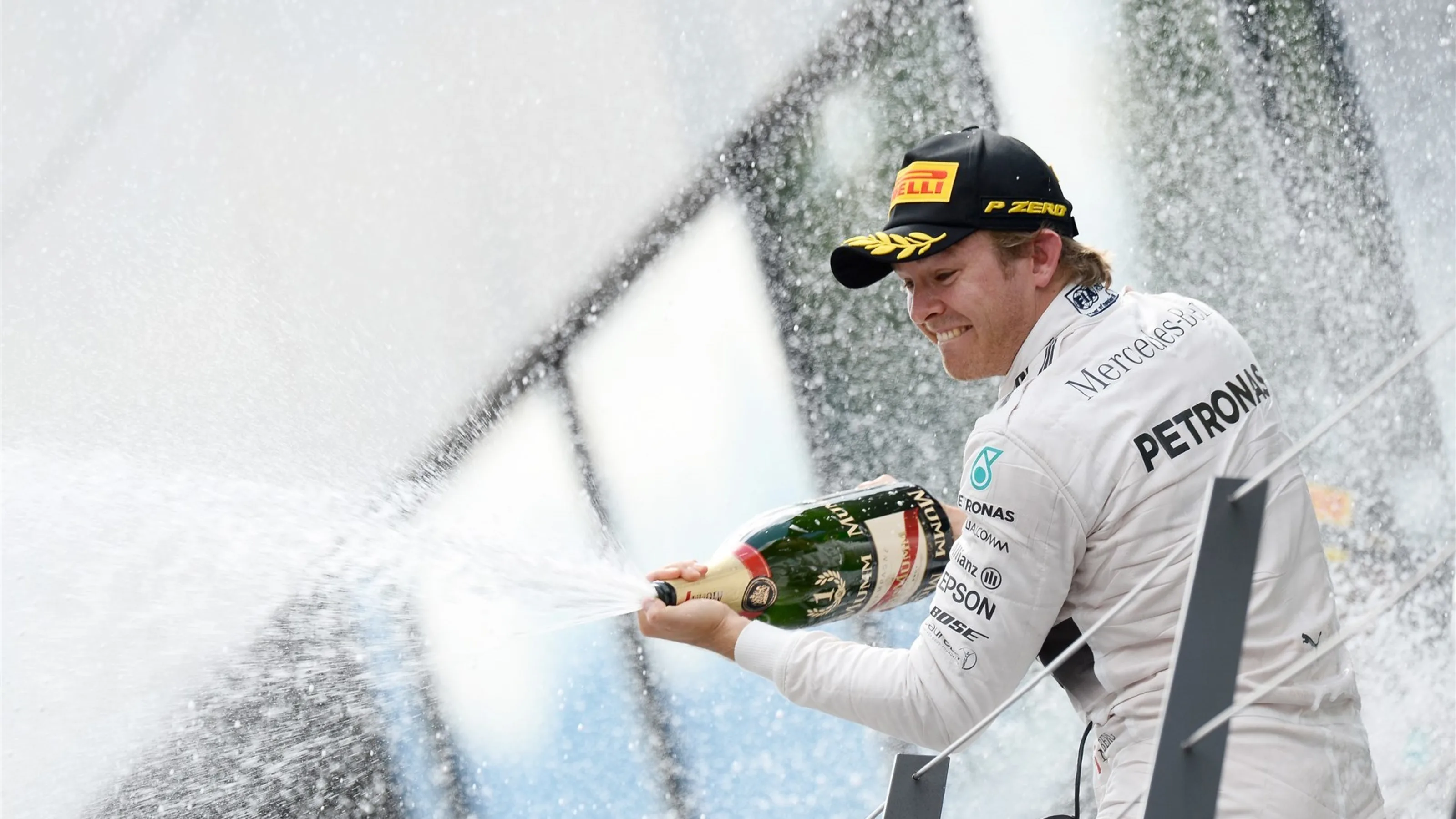 Nico Rosberg (GER) Mercedes AMG F1 celebrates with champagne on the podium at Formula One World