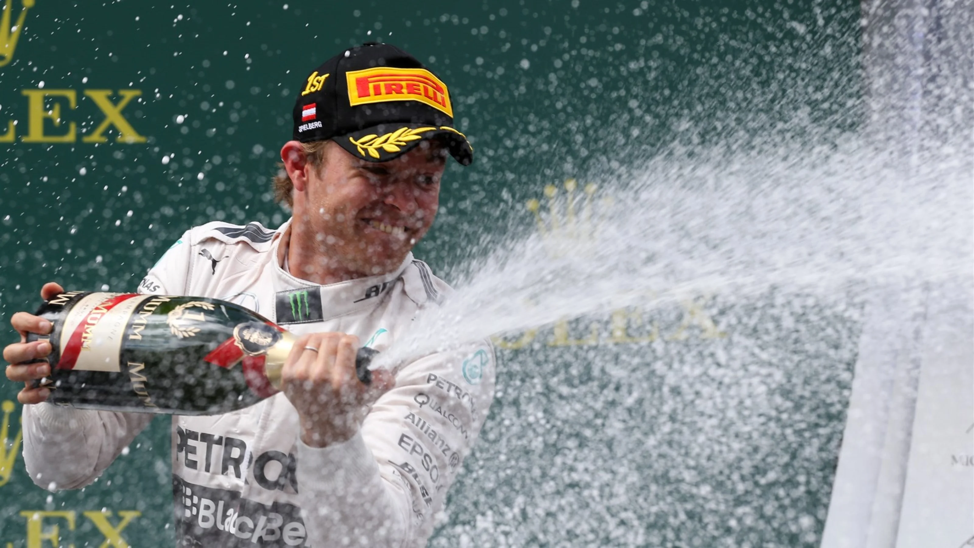 Race winner Nico Rosberg (GER) Mercedes AMG F1 celebrates with the champagne on the podium at