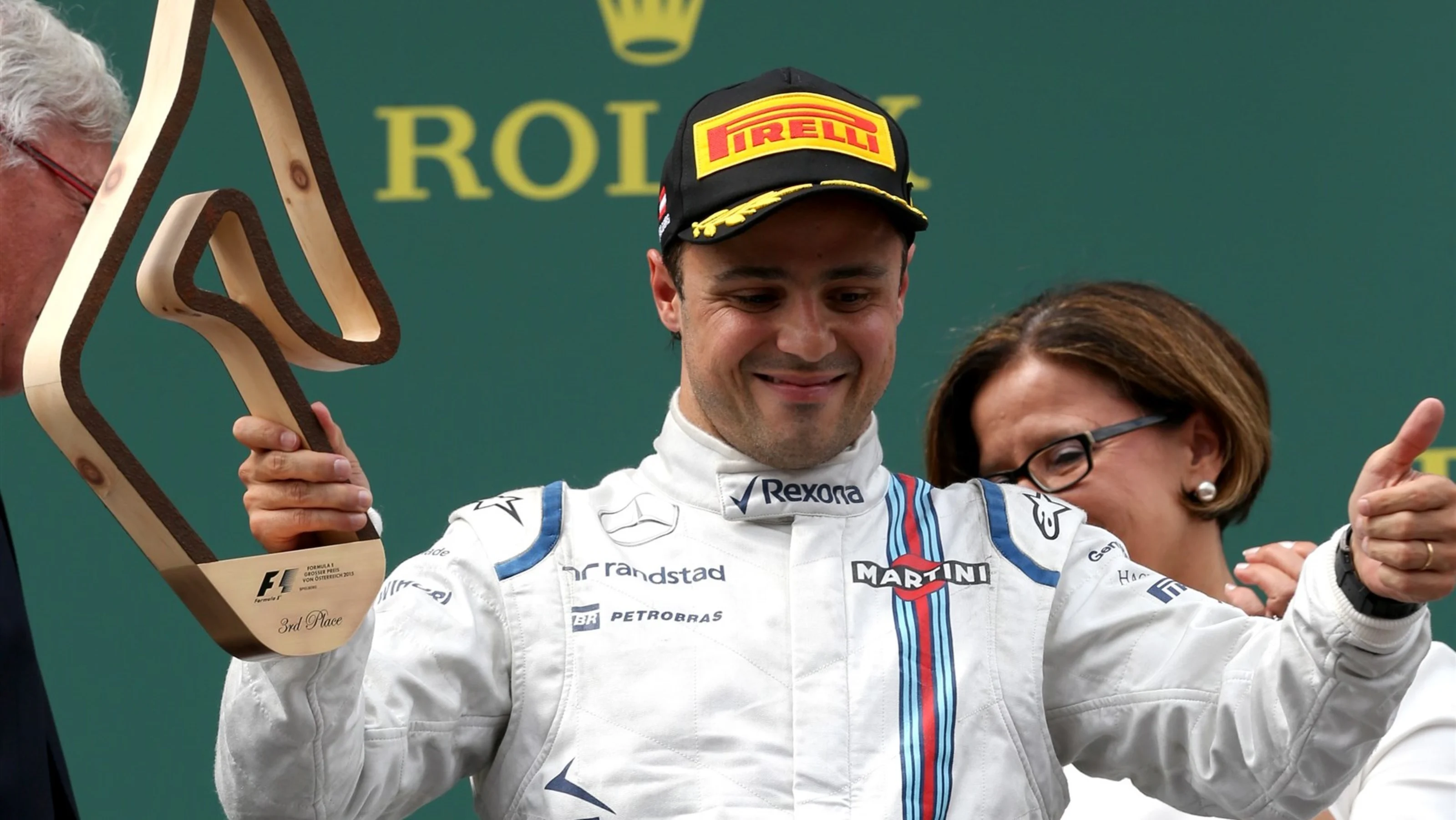 Felipe Massa (BRA) Williams celebrates with the trophy on the podium at Formula One World