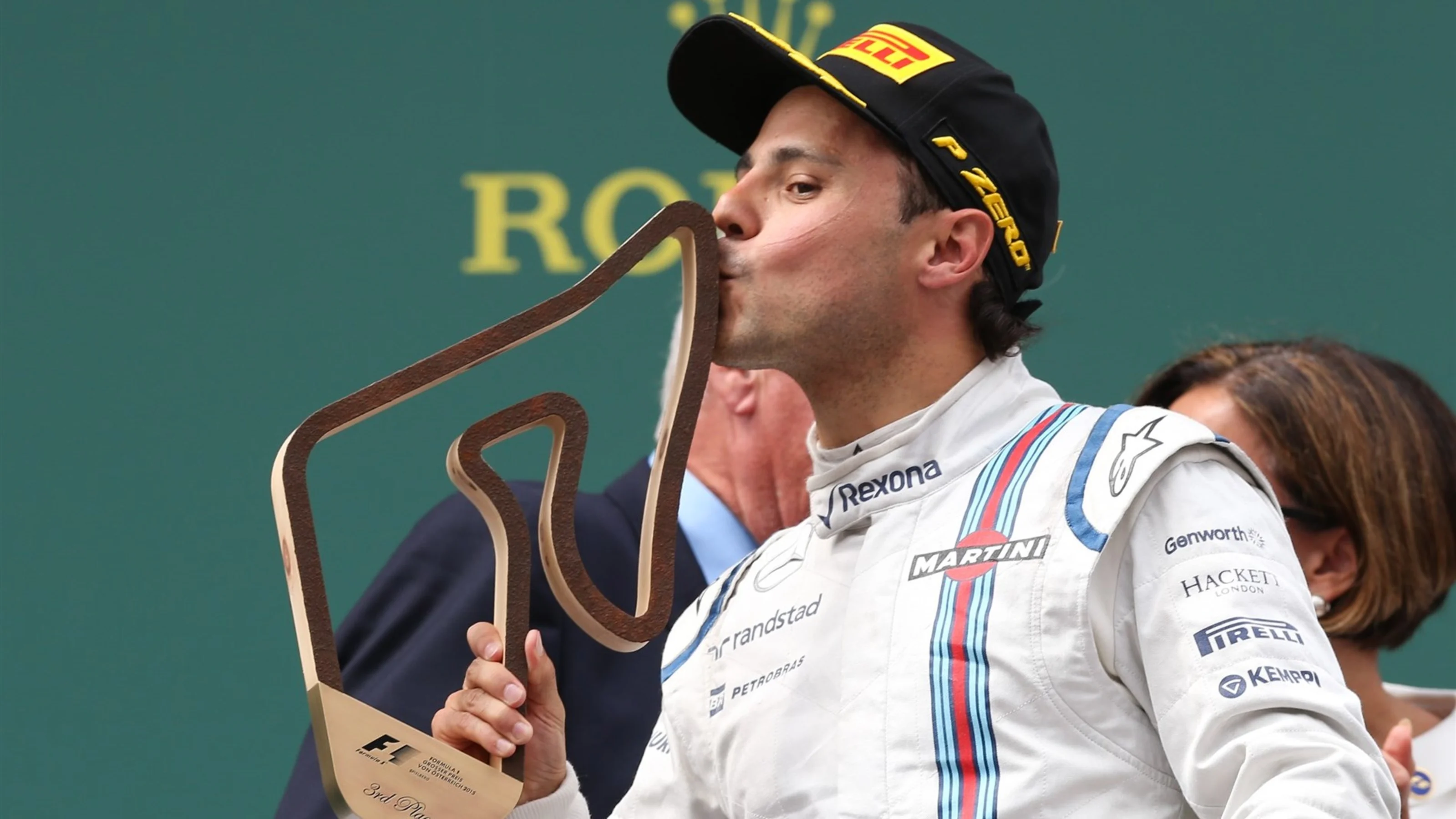 Felipe Massa (BRA) Williams celebrates with the trophy on the podium at Formula One World