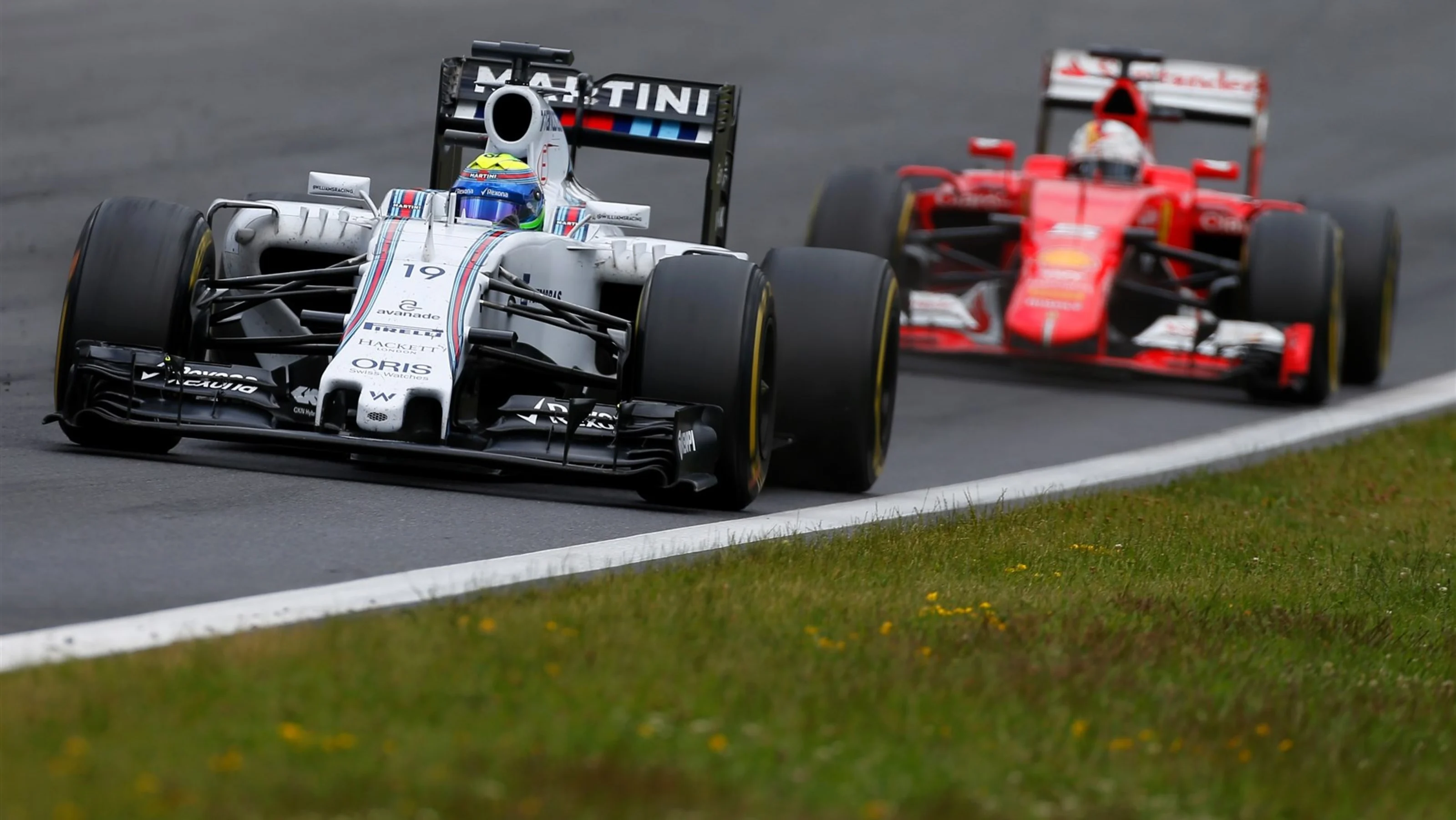 Felipe Massa (BRA) Williams FW37 leads Sebastian Vettel (GER) Ferrari SF15-T at Formula One World