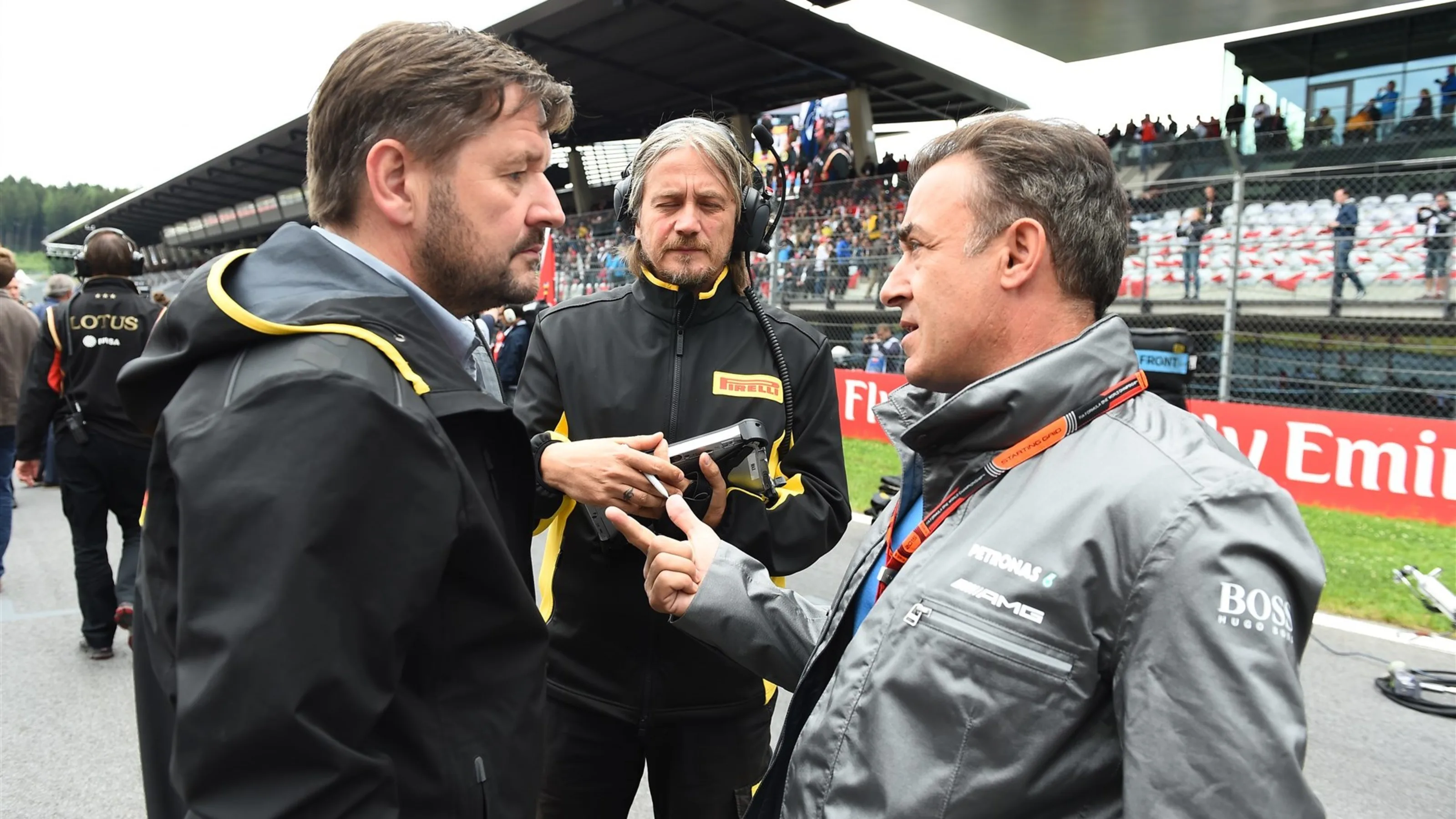 Paul Hembery (GBR) Pirelli Motorsport Director and Jean Alesi (FRA) on the grid at Formula One