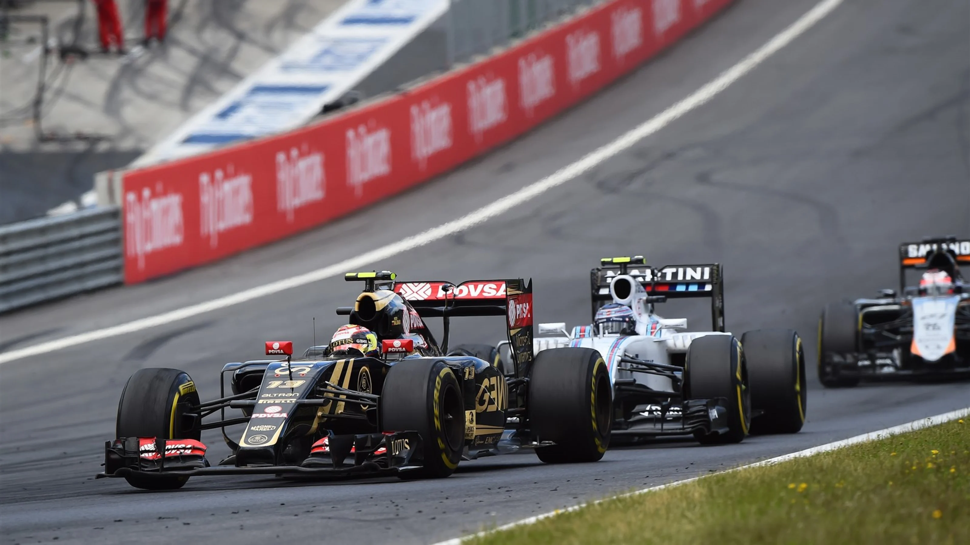 Pastor Maldonado (VEN) Lotus E23 Hybrid leads Valtteri Bottas (FIN) Williams FW37 at Formula One
