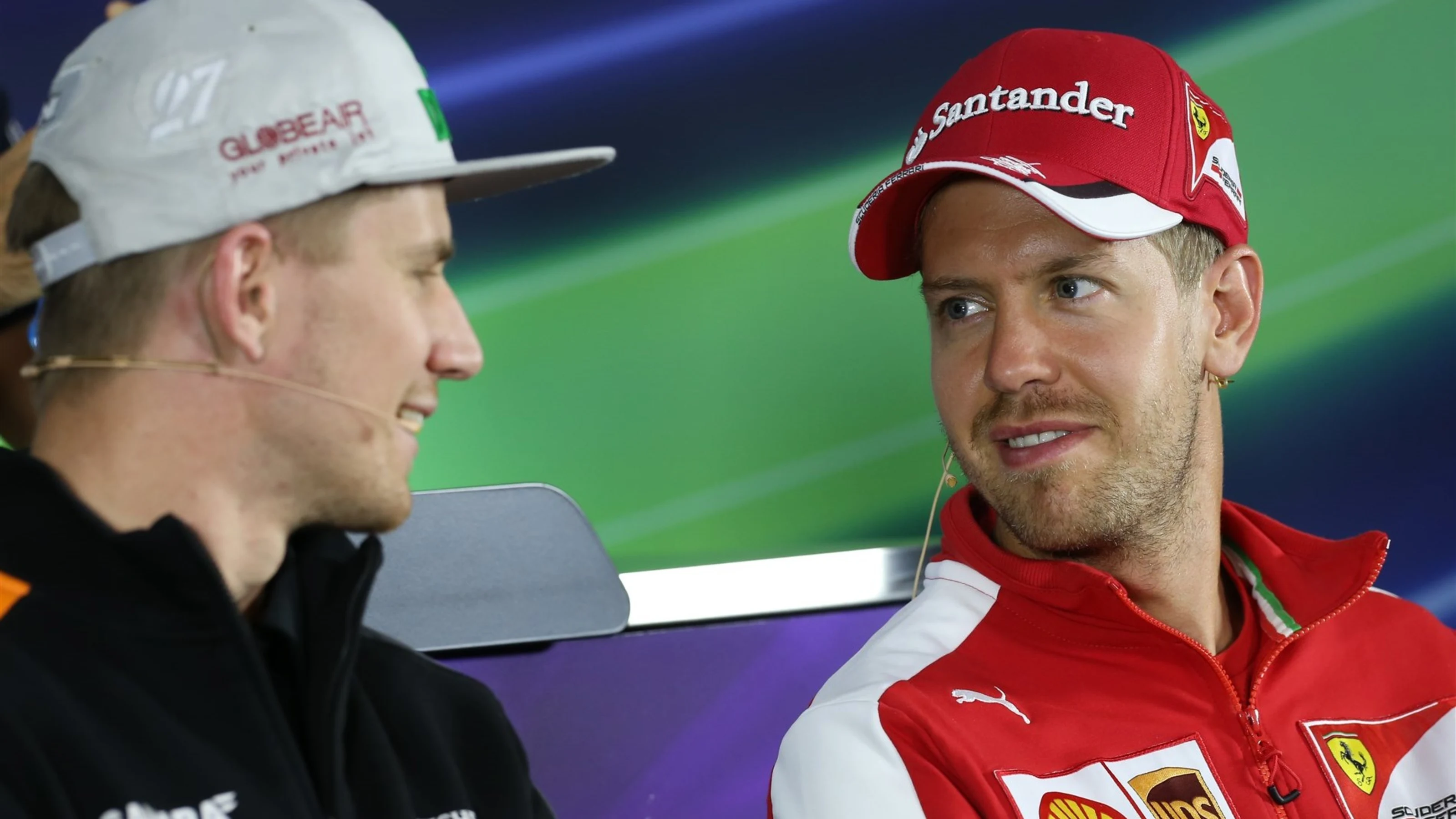 Nico Hulkenberg (GER) Force India F1 and Sebastian Vettel (GER) Ferrari in the press conference at