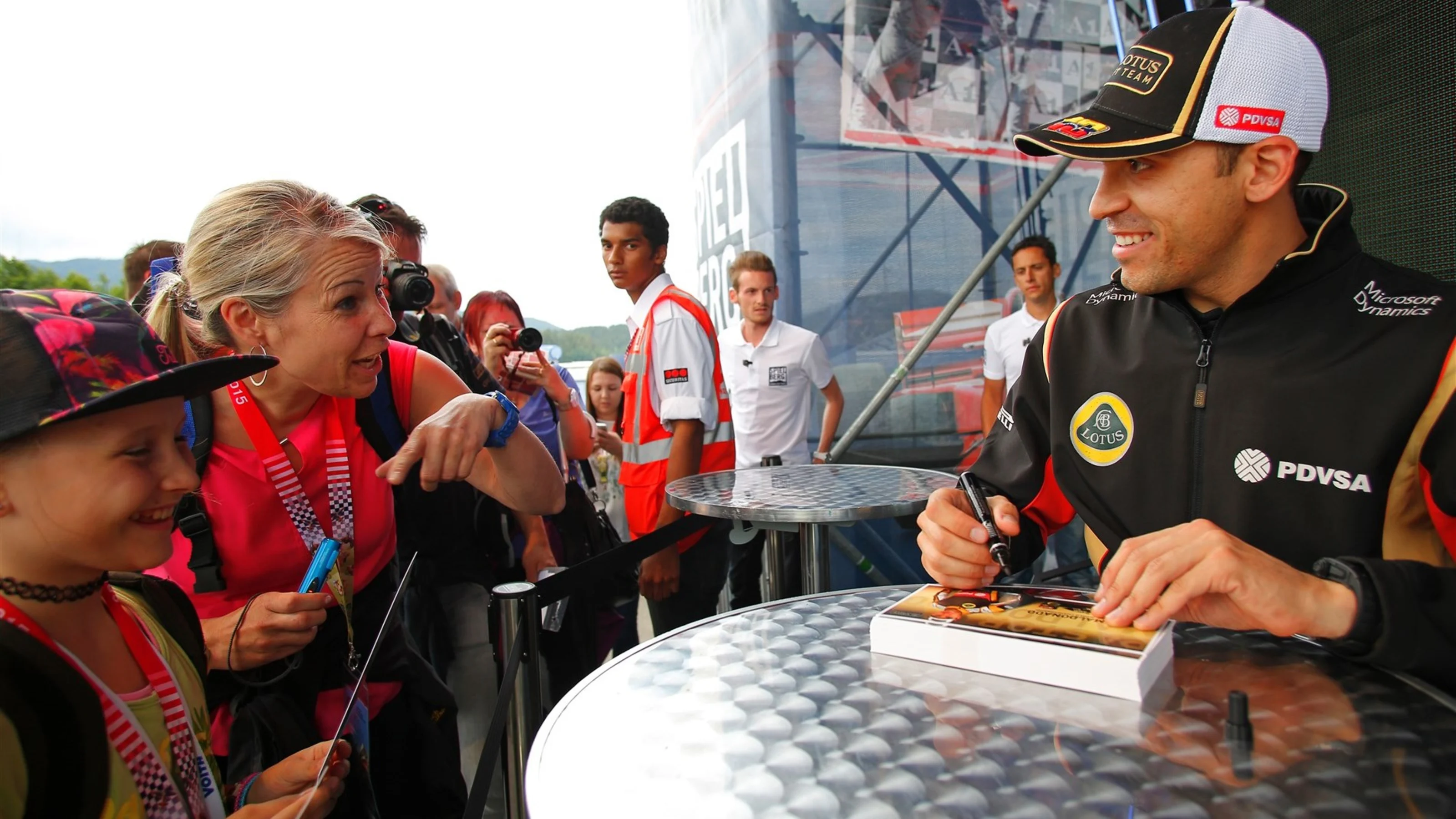 Pastor Maldonado (VEN) Lotus signs autographs for the fans at Formula One World Championship, Rd8,