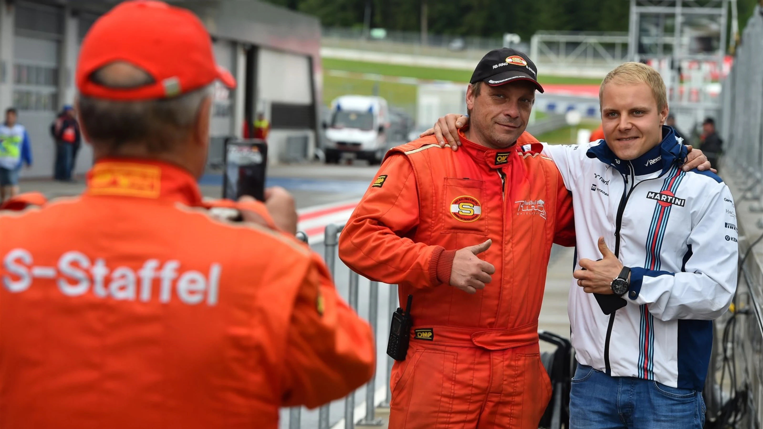 Valtteri Bottas (FIN) Williams poses for a photo with a marshal at Formula One Testing, Day One,