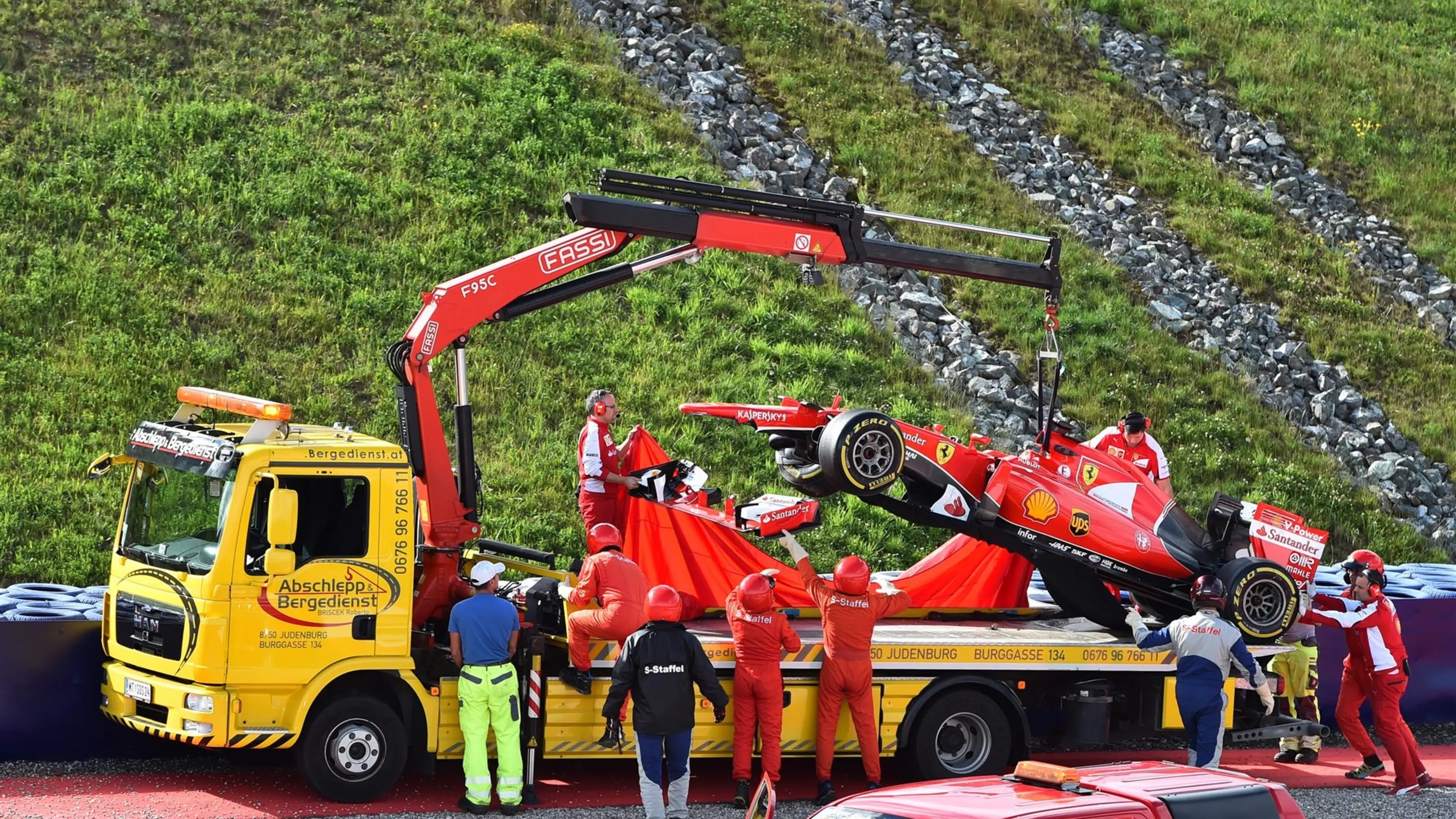 The crashed car of Antonio Fuoco (ITA) Ferrari SF15-T is recovered at Formula One Testing, Day One,