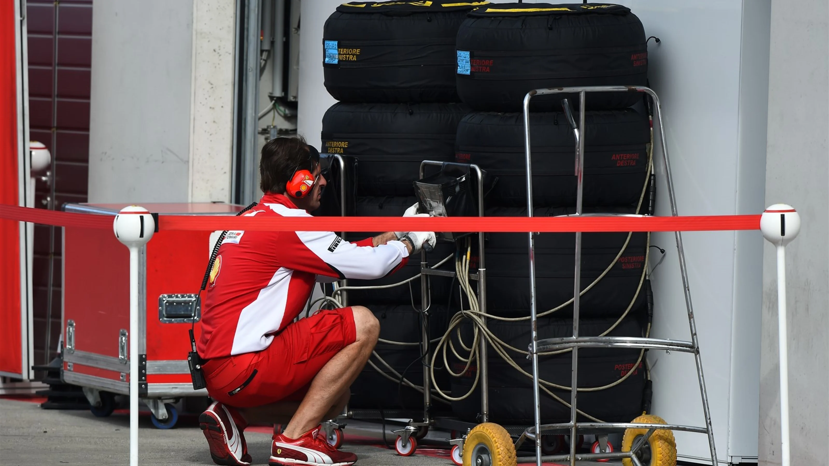 Ferrari mechanic with Pirelli tyres at Formula One Testing, Day Two, Spielberg, Austria, Wednesday