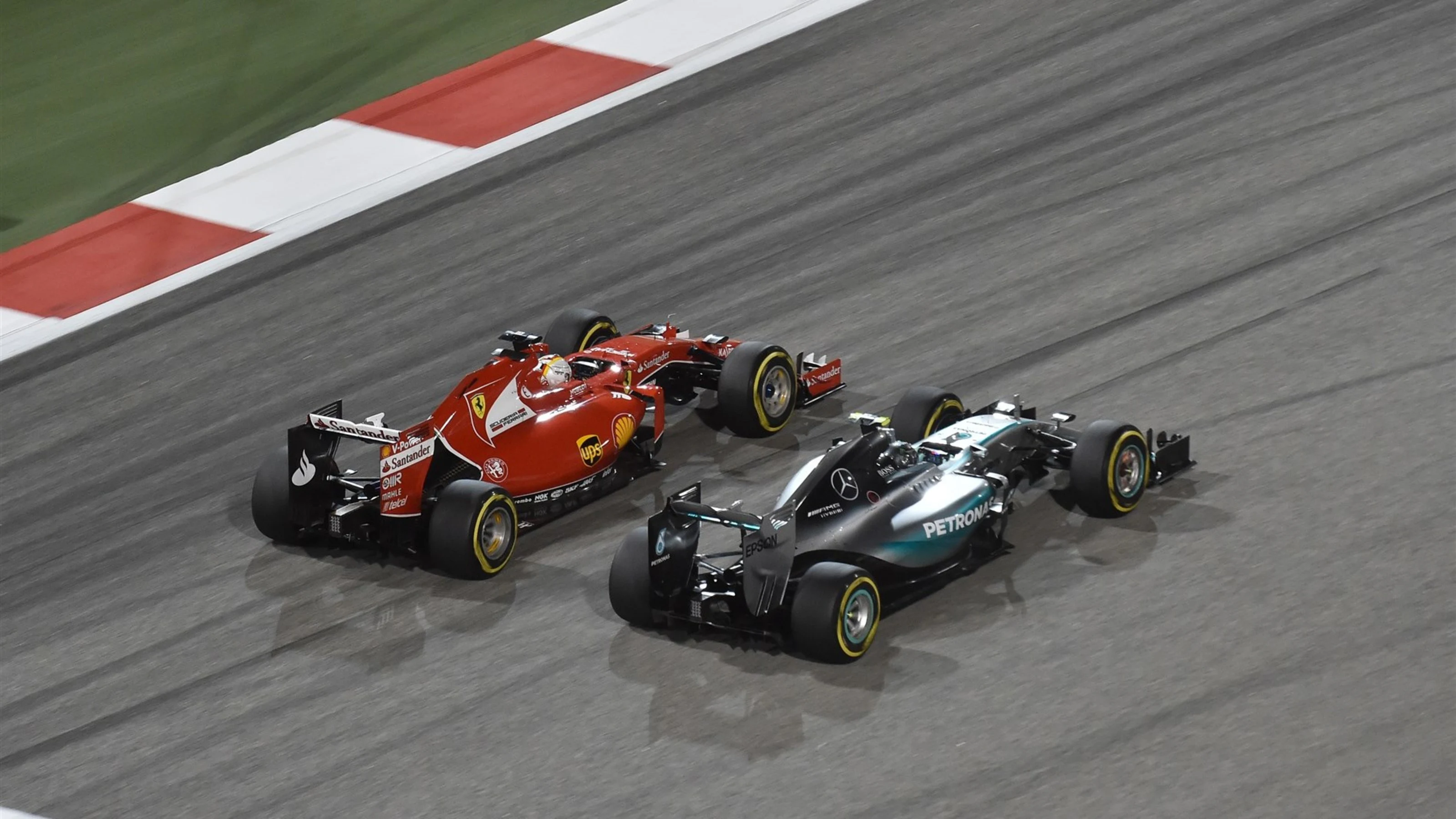 Sebastian Vettel (GER) Ferrari SF15-T and Nico Rosberg (GER) Mercedes AMG F1 W06 at Formula One