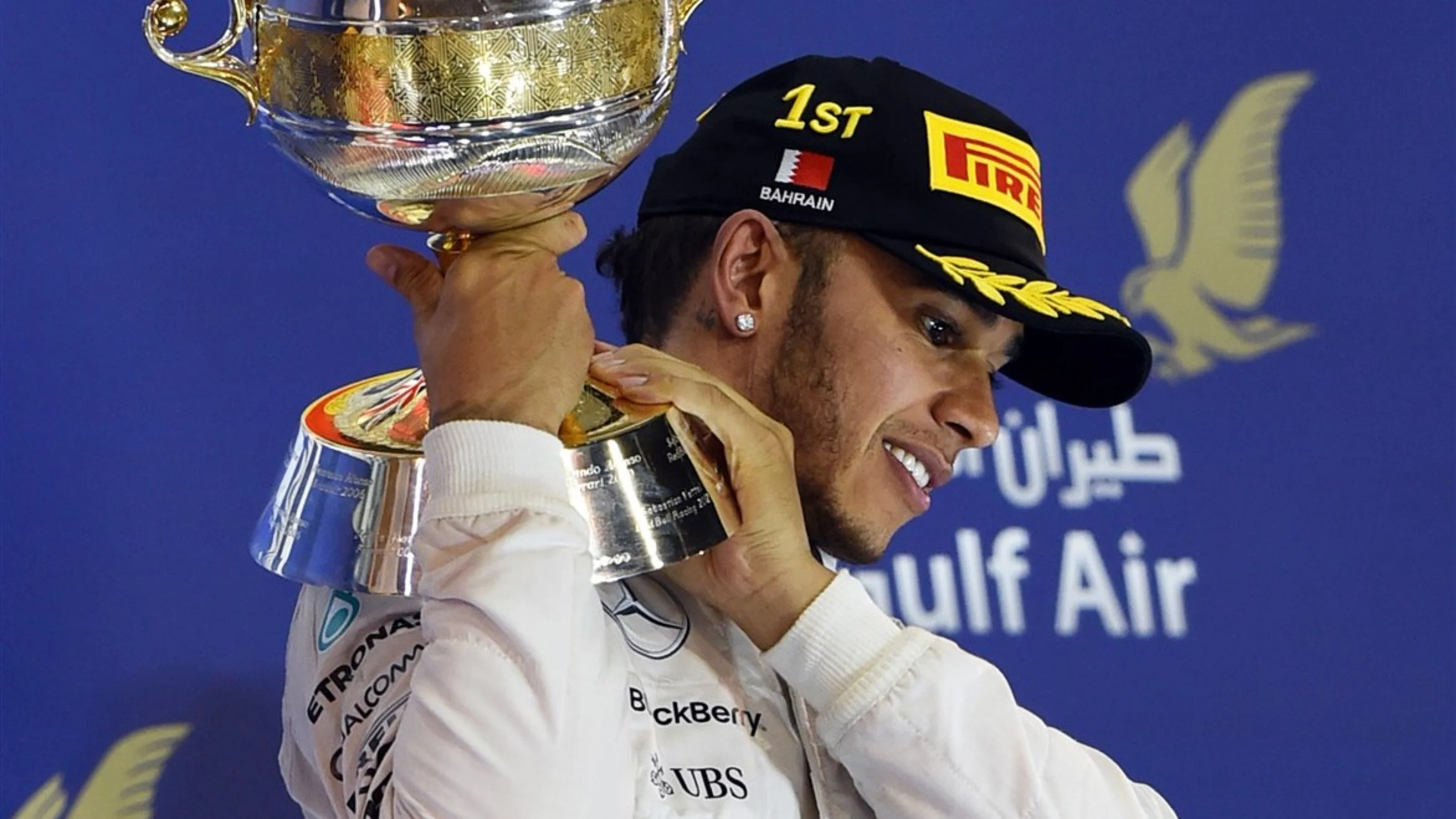 Race winner Lewis Hamilton (GBR) Mercedes AMG F1 celebrates on the podium with the trophy at
