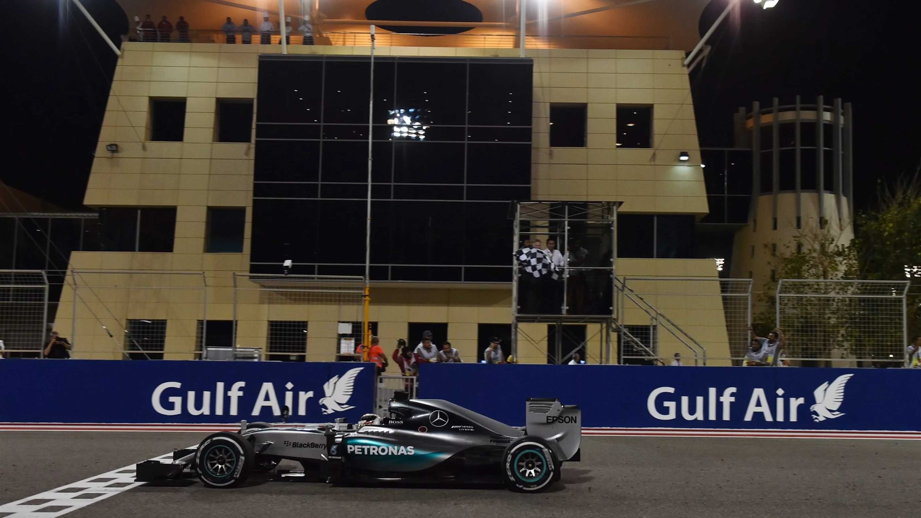 Race winner Lewis Hamilton (GBR) Mercedes AMG F1 W06 crosses the line to take the chequered flag at