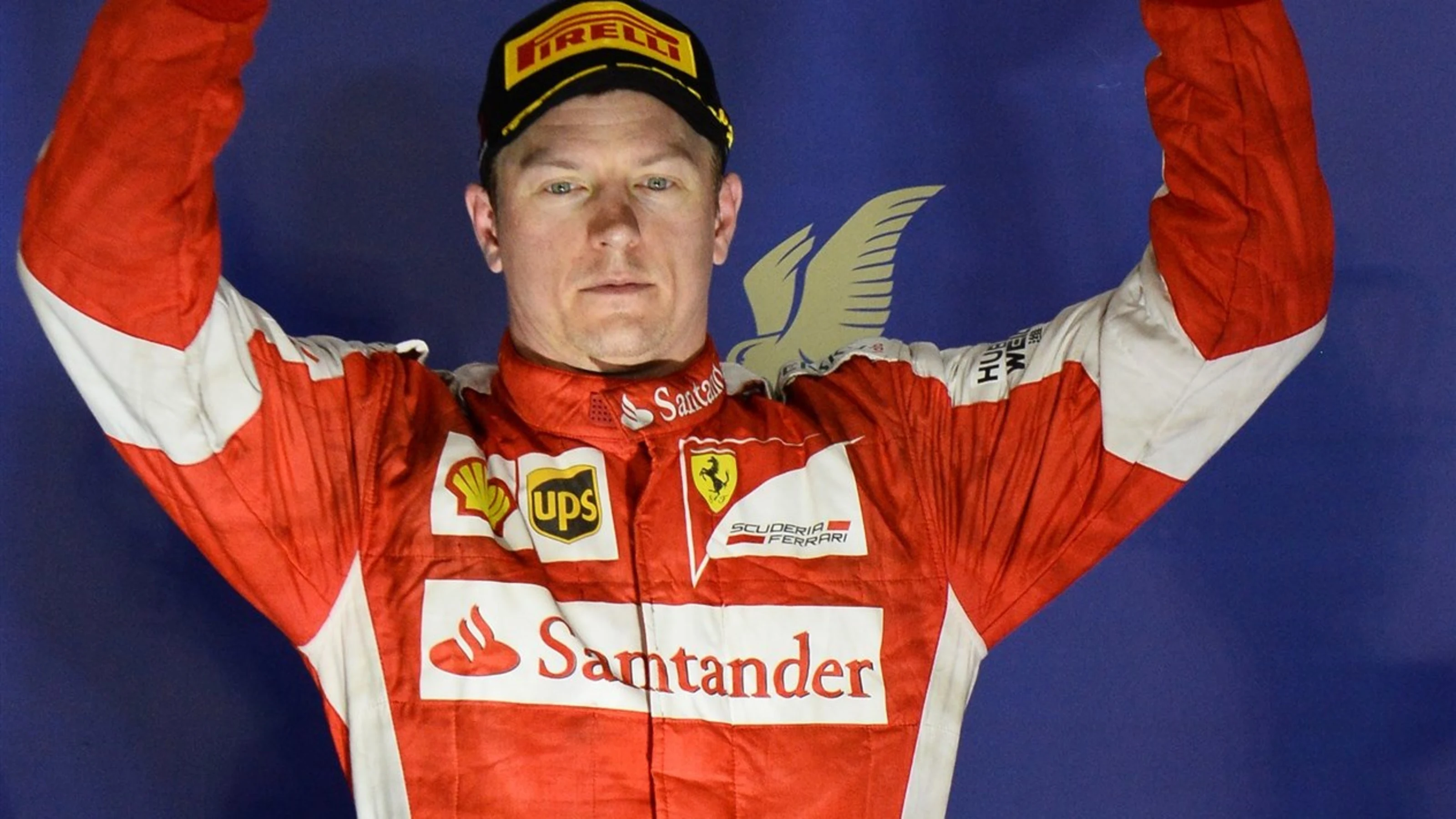 Kimi Raikkonen (FIN) Ferrari celebrates with his trophy on the podium at Formula One World
