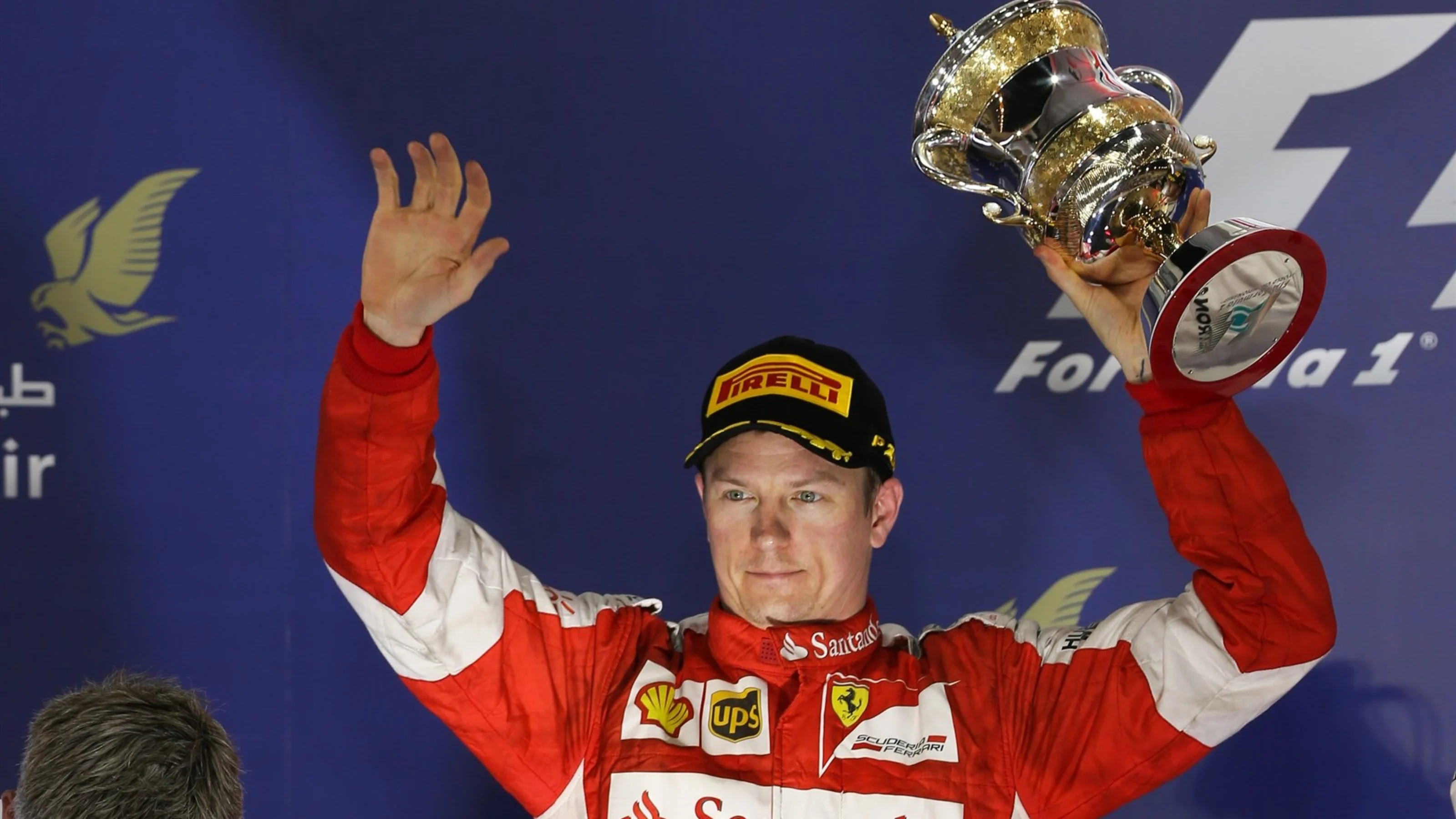 Kimi Raikkonen (FIN) Ferrari celebrates with his trophy on the podium at Formula One World