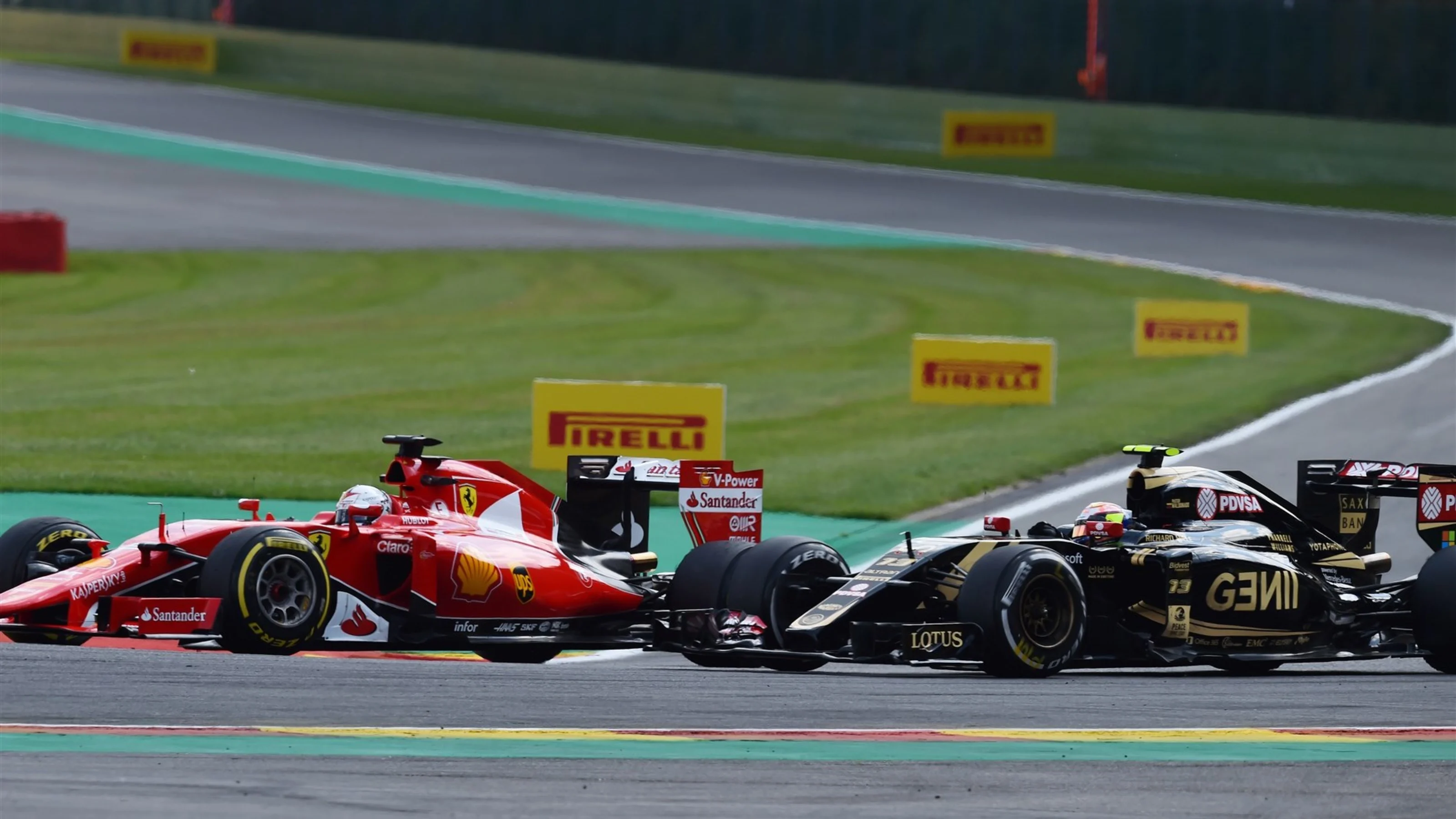 Sebastian Vettel (GER) Ferrari SF15-T and Pastor Maldonado (VEN) Lotus E23 Hybrid at Formula One