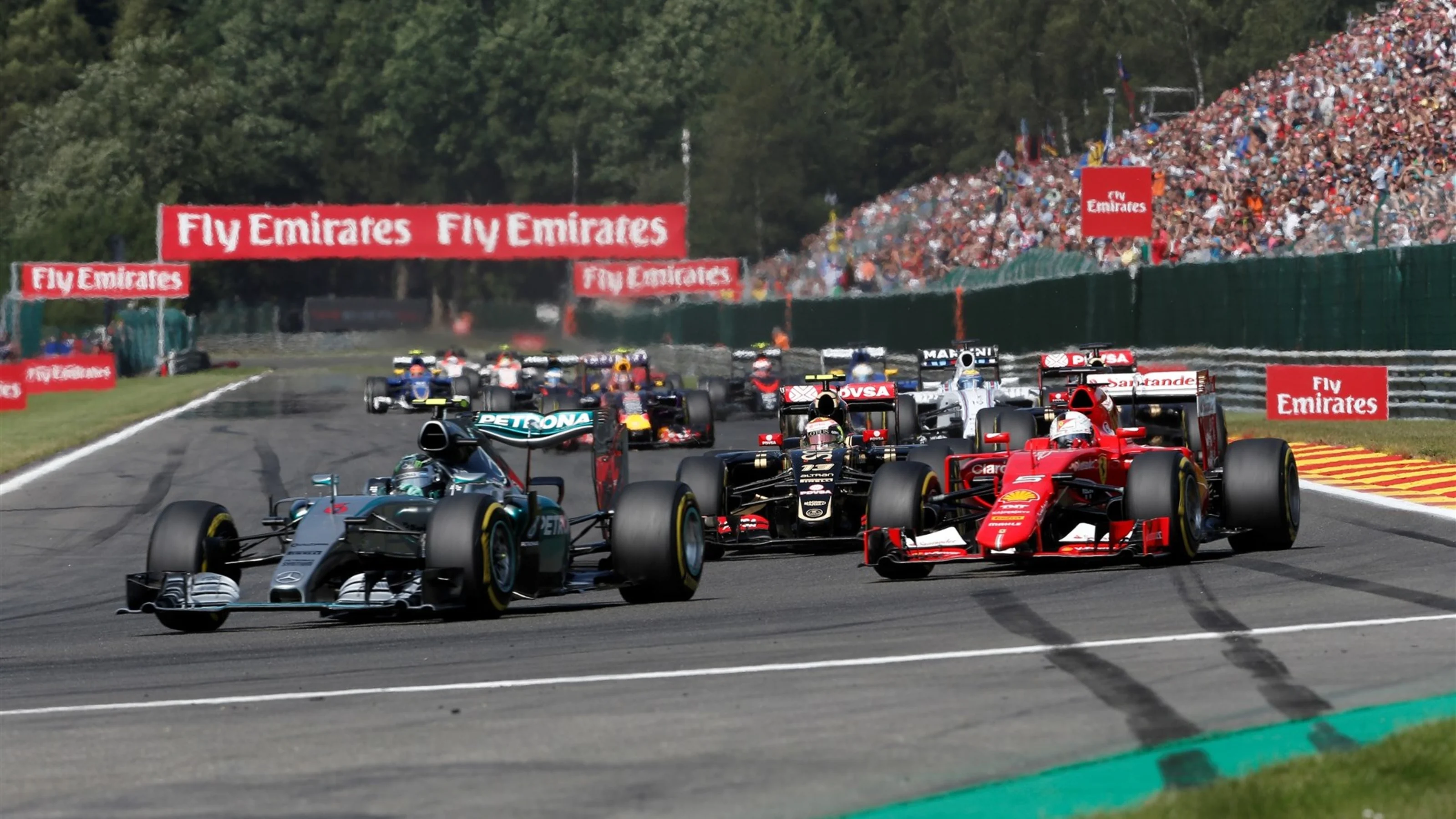 Nico Rosberg (GER) Mercedes AMG F1 W06 and Sebastian Vettel (GER) Ferrari SF15-T at the start of